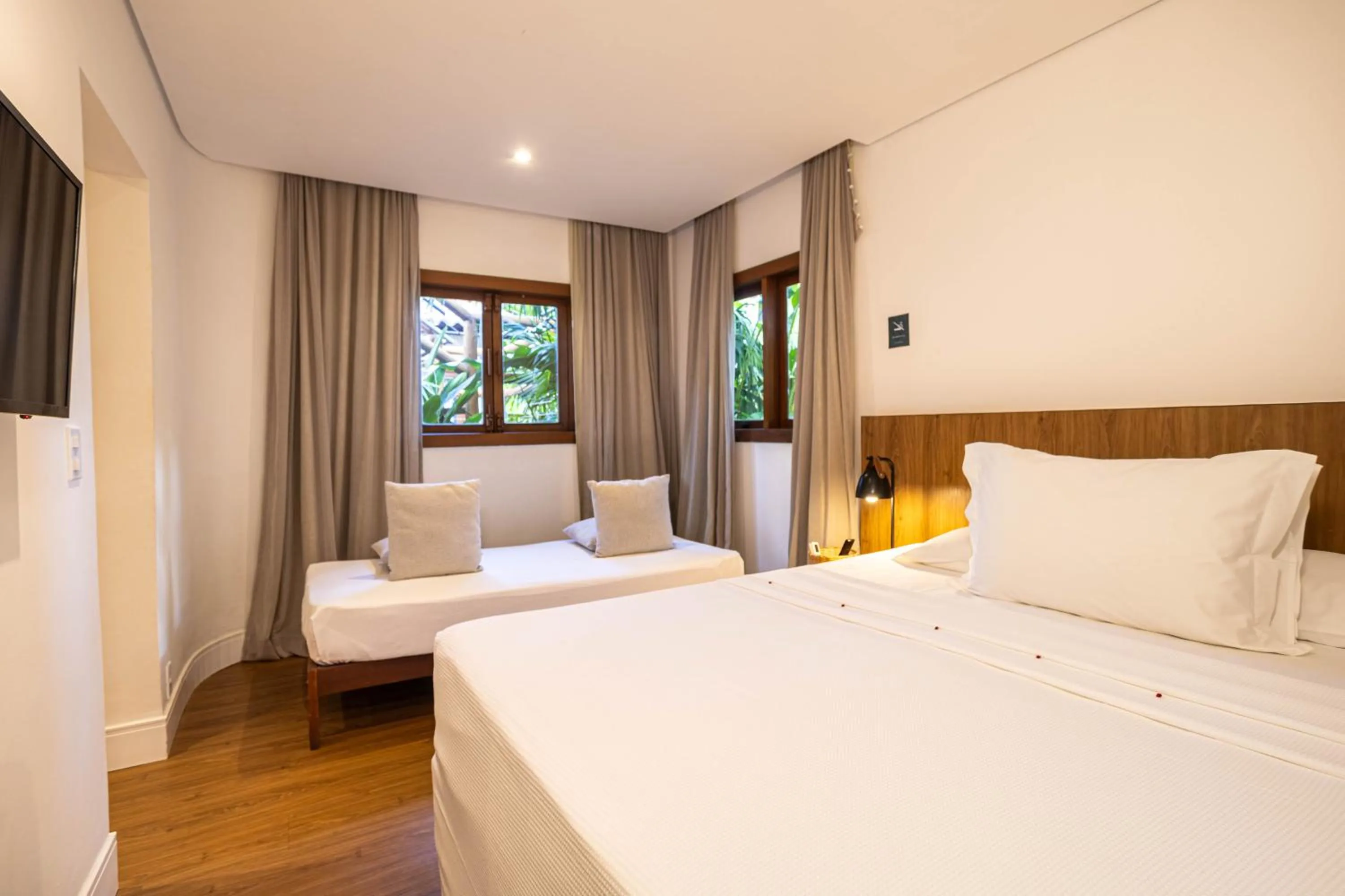 Property building, Bed in Pousada Cheiro Verde