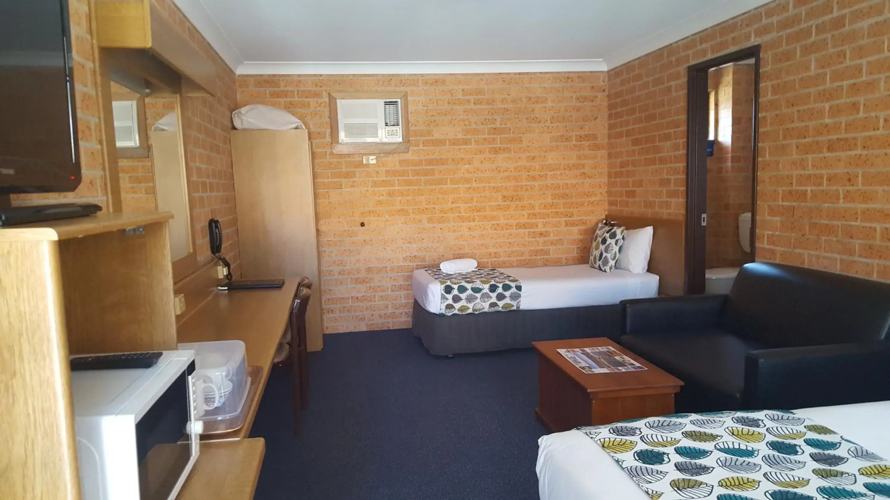 Bed in Royal Palms Motor Inn Bed in Royal Palms Motor Inn