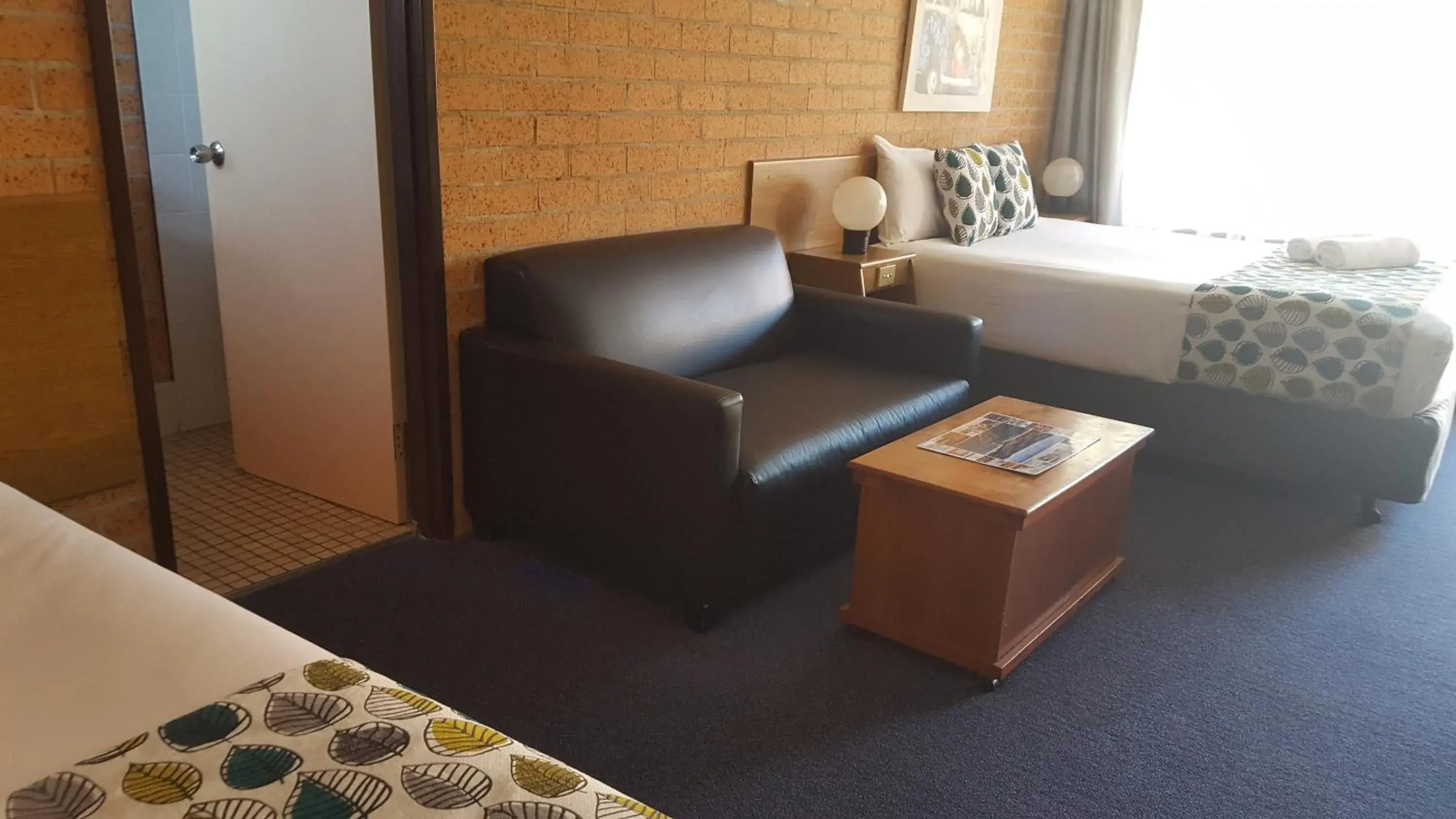 Bed in Royal Palms Motor Inn Bed in Royal Palms Motor Inn