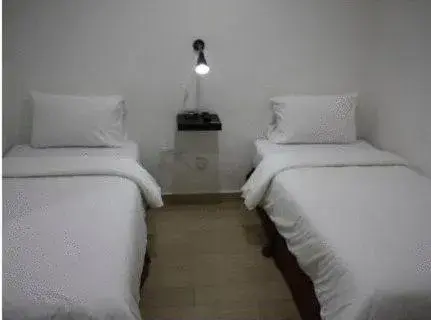 Bed in Dynasty Inn - Wakaf Che Yeh Bed in Dynasty Inn - Wakaf Che Yeh