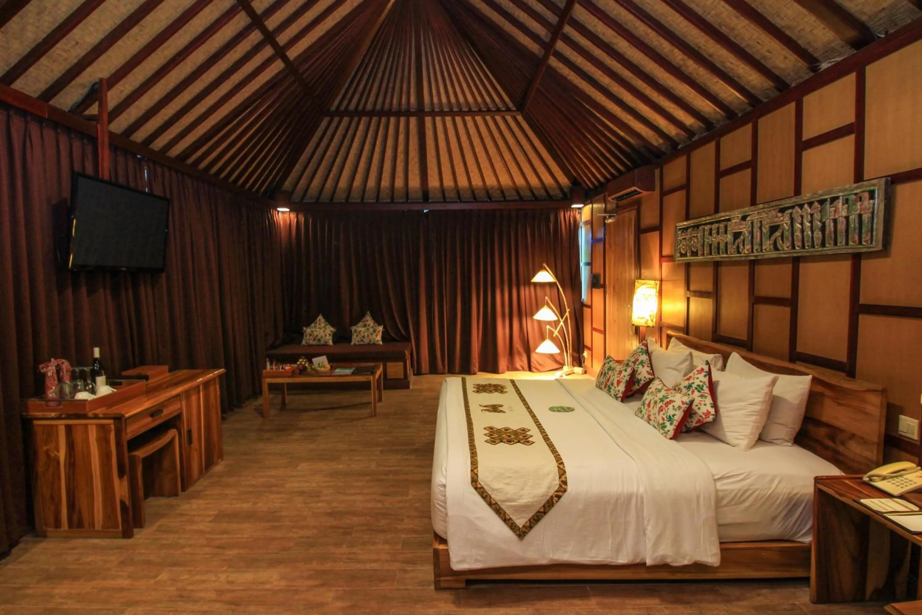 Photo of the whole room, Bed in Kupu Kupu Jimbaran Beach Hotel & Spa by L’Occitane