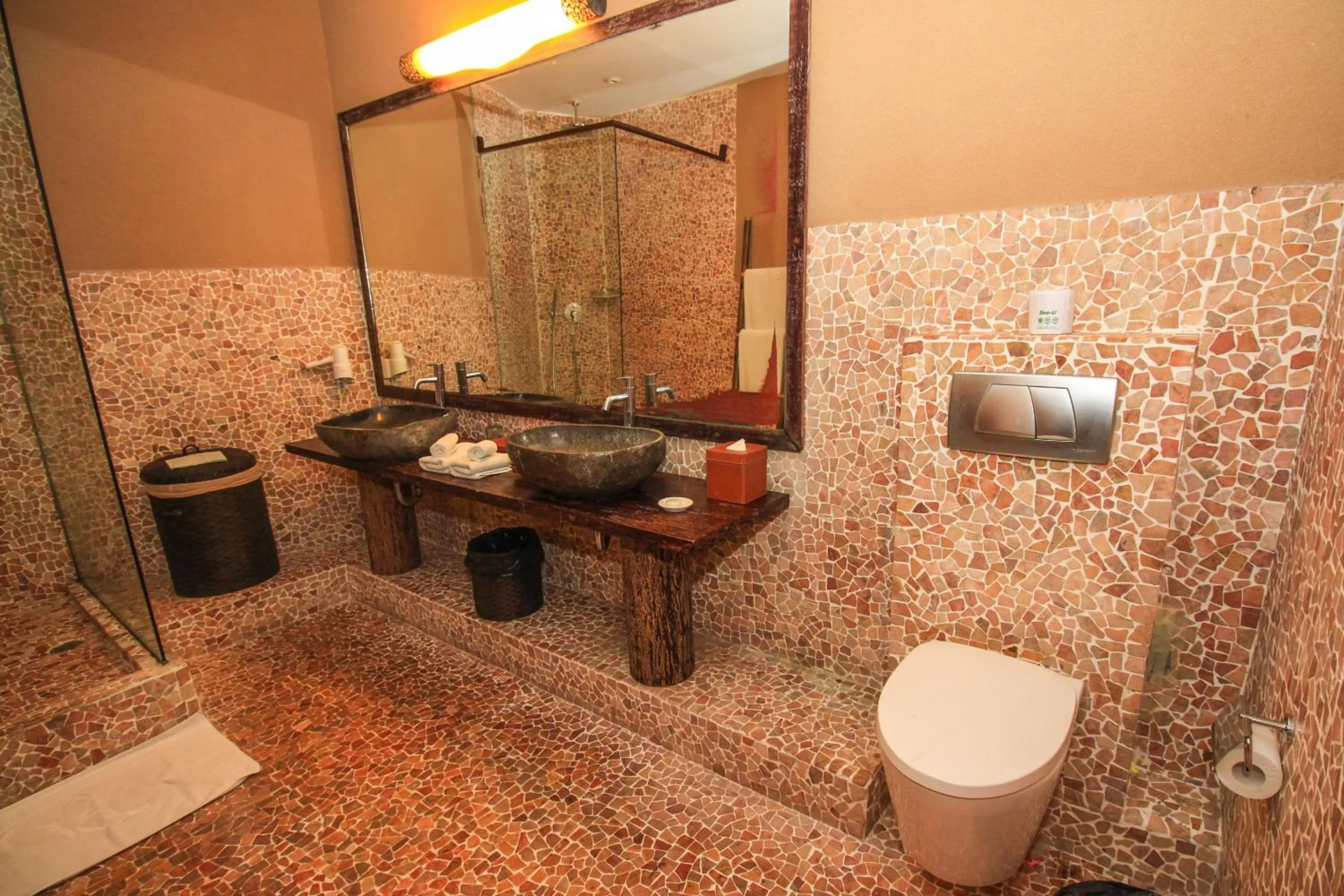 Bathroom in Kupu Kupu Jimbaran Beach Hotel & Spa by L’Occitane