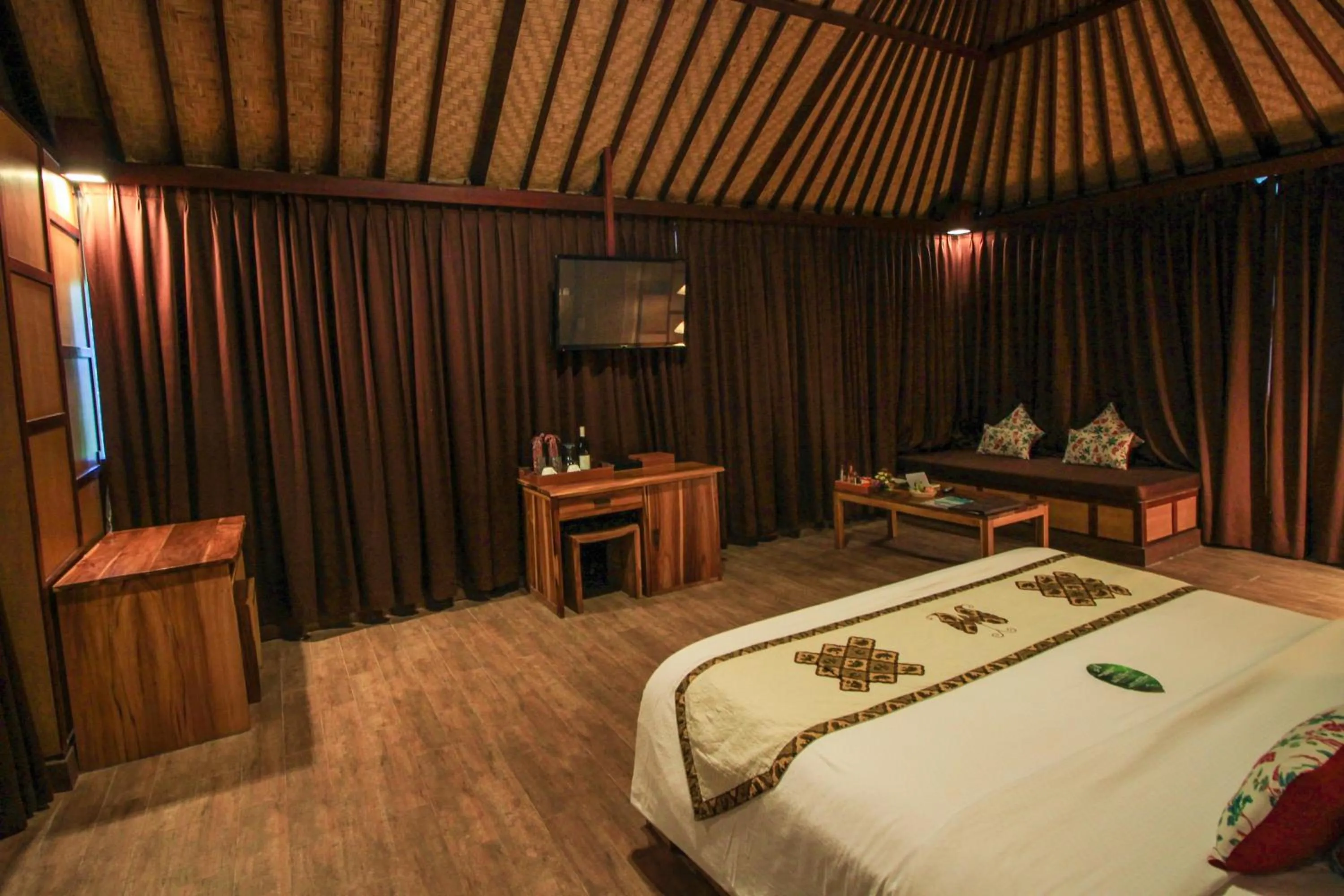 Photo of the whole room, Bed in Kupu Kupu Jimbaran Beach Hotel & Spa by L’Occitane