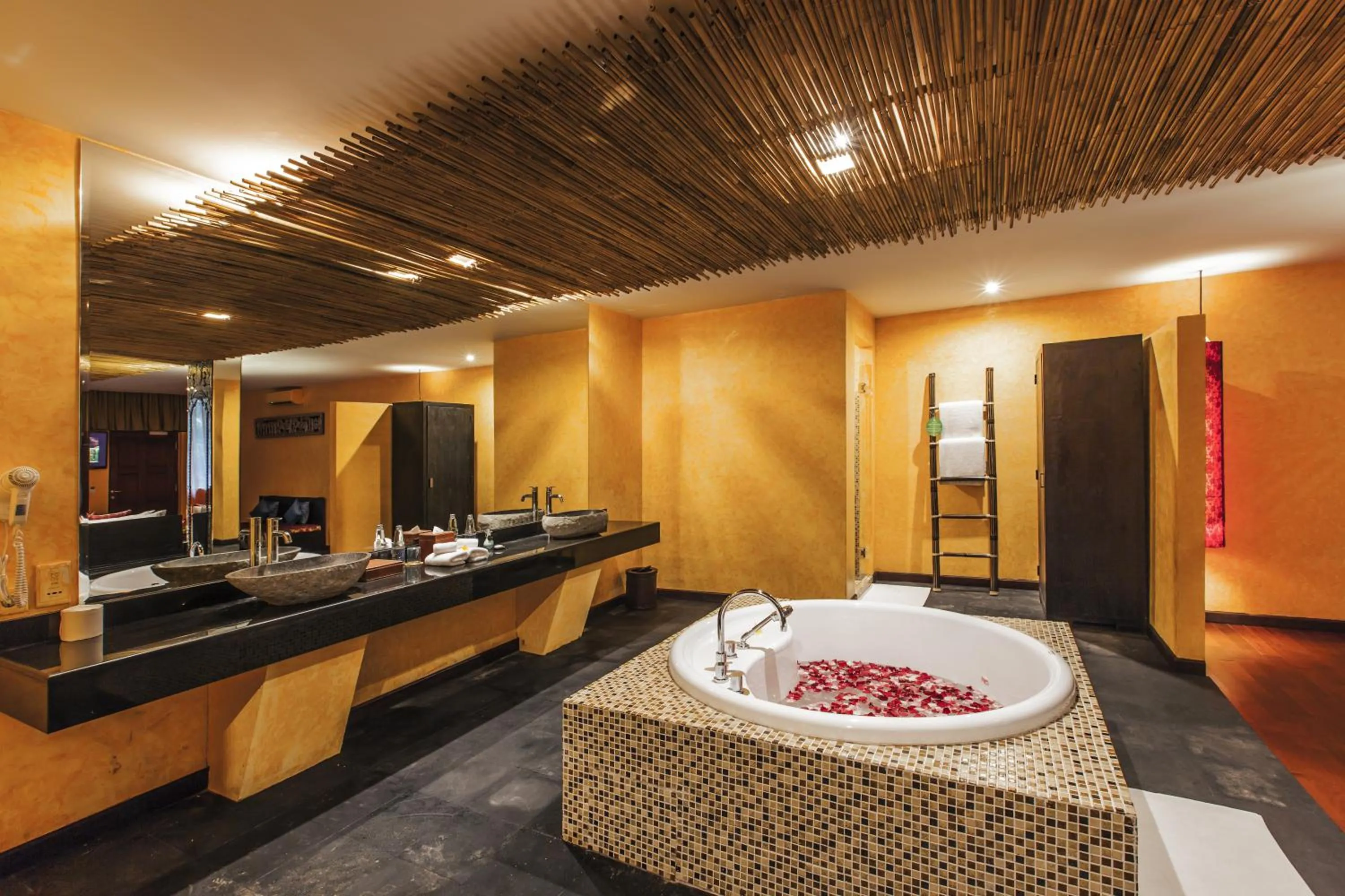 Bathroom in Kupu Kupu Jimbaran Beach Hotel & Spa by L’Occitane