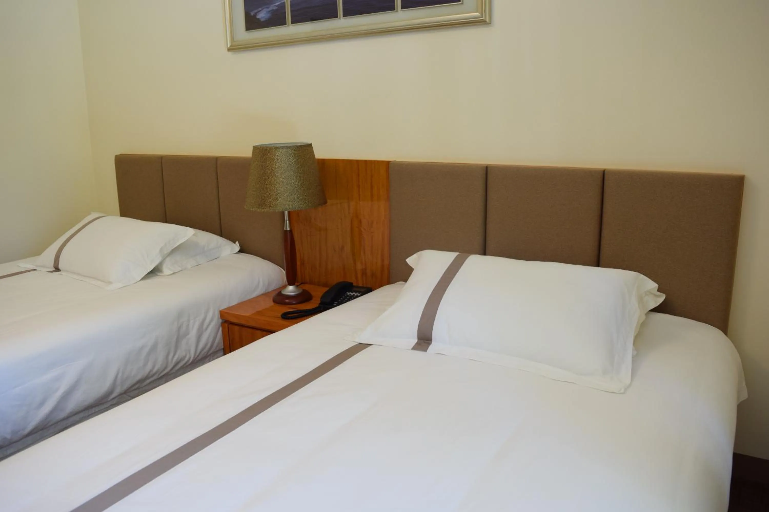 Bed in Saipan Beach Hotel