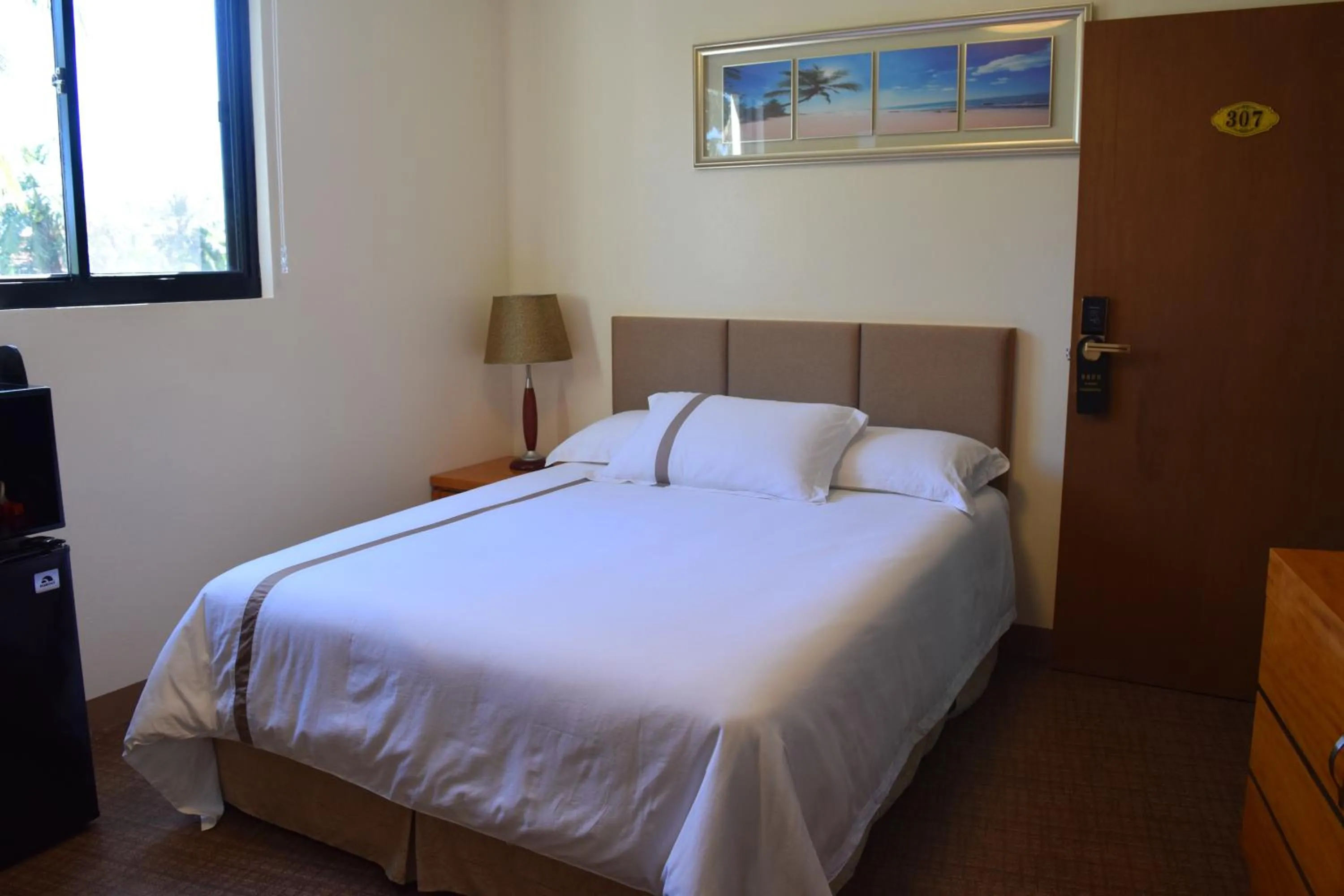 Photo of the whole room, Bed in Saipan Beach Hotel