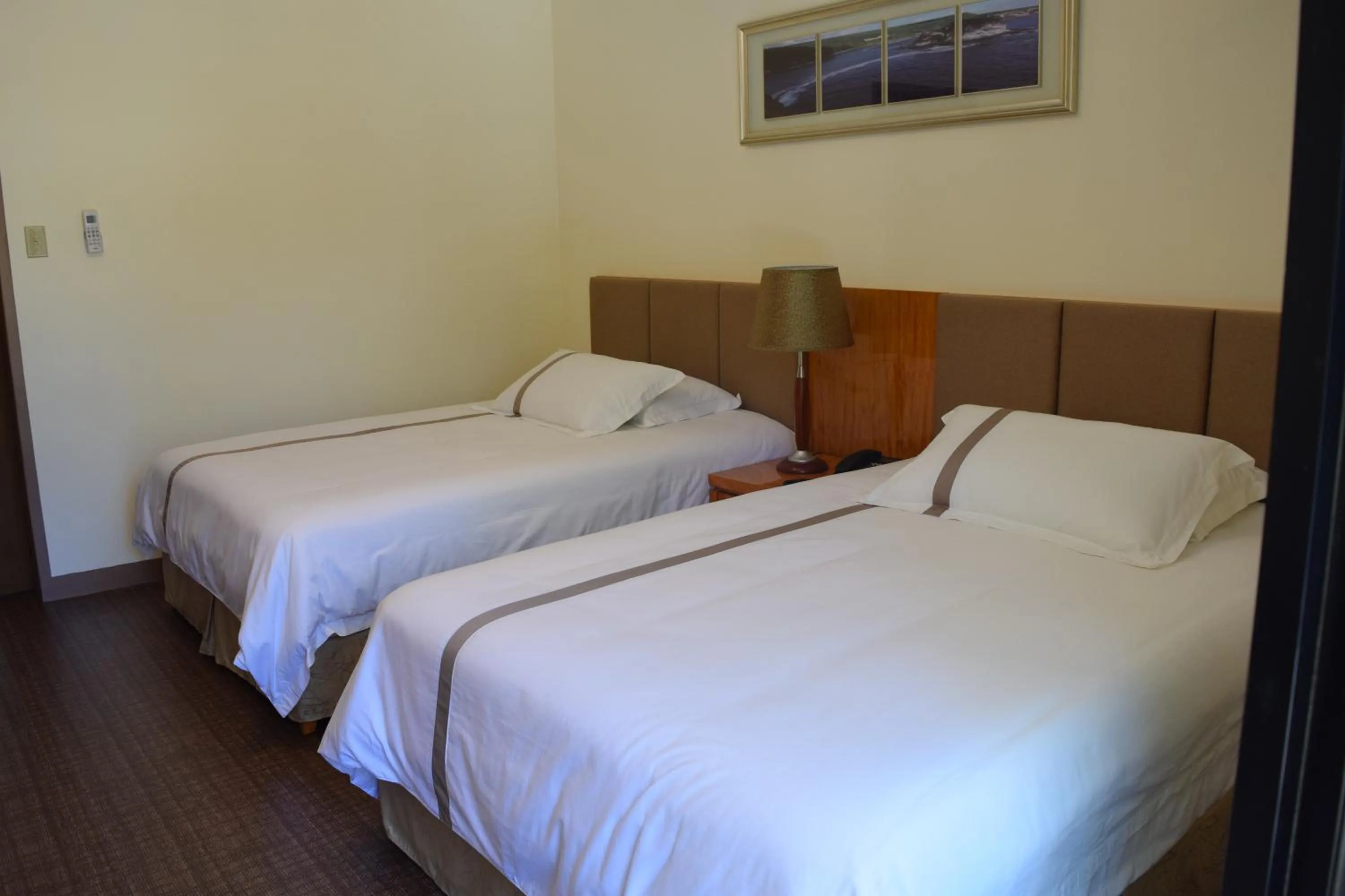 Bed in Saipan Beach Hotel