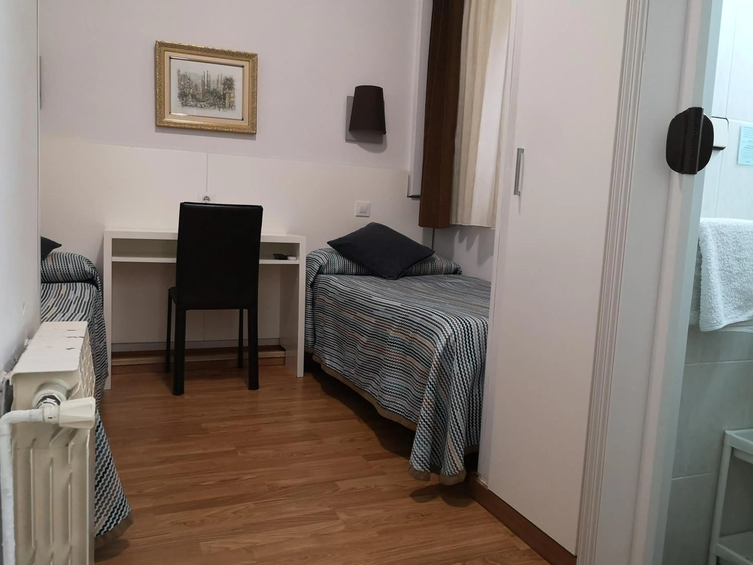 Bed in Hostal Lesseps