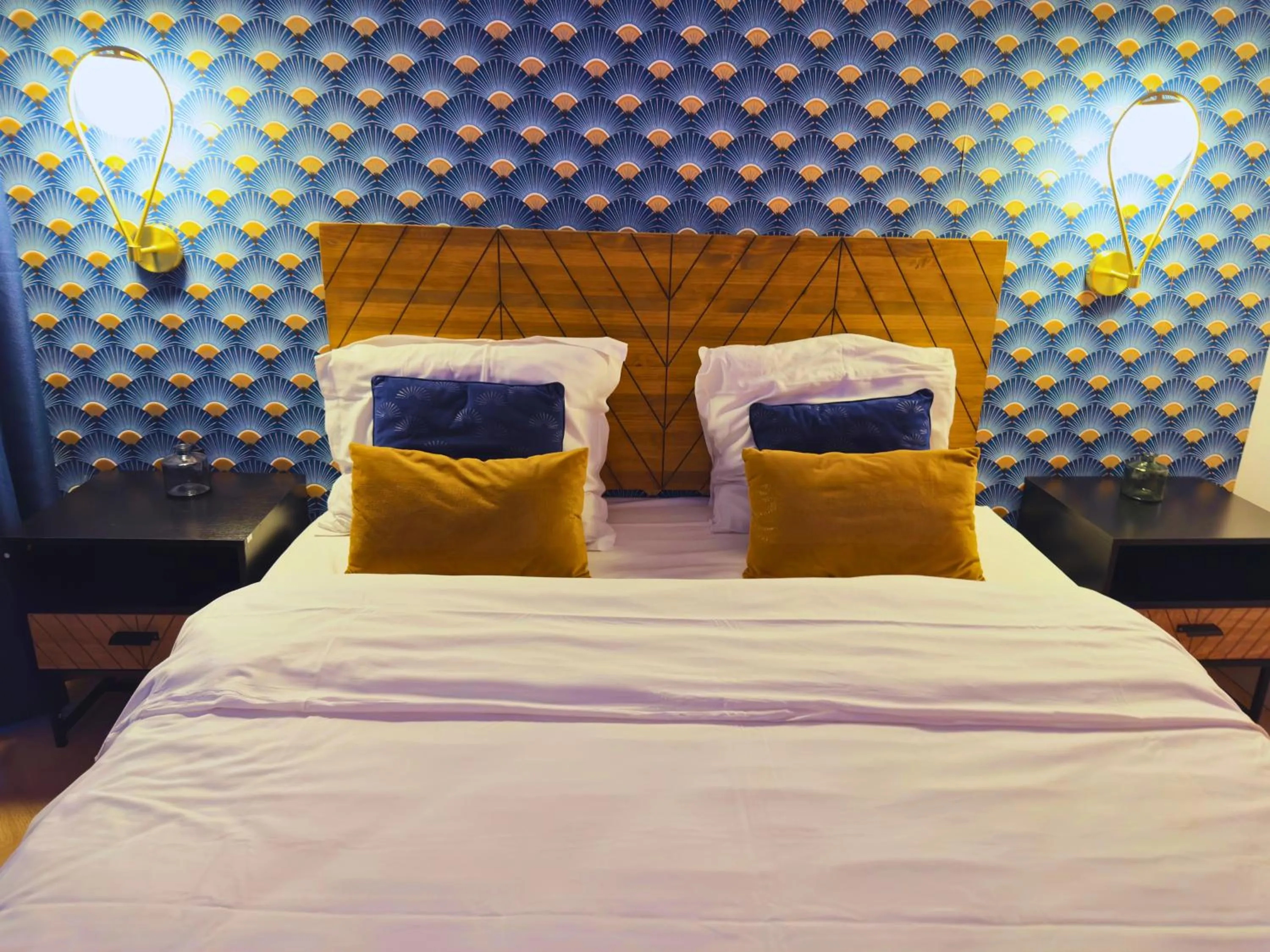 Bed in L'Escale Appartements et Suites en bord de Mer