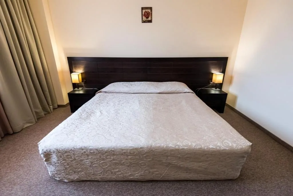 Bed in Gardenia Park Hotel