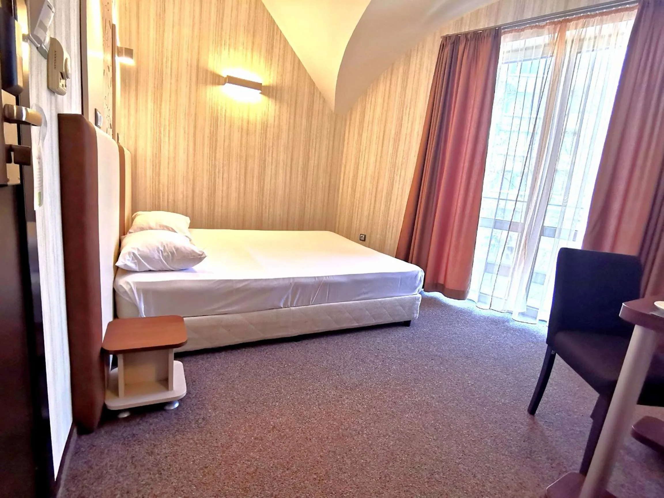 Bed in Elate Plaza Hotel