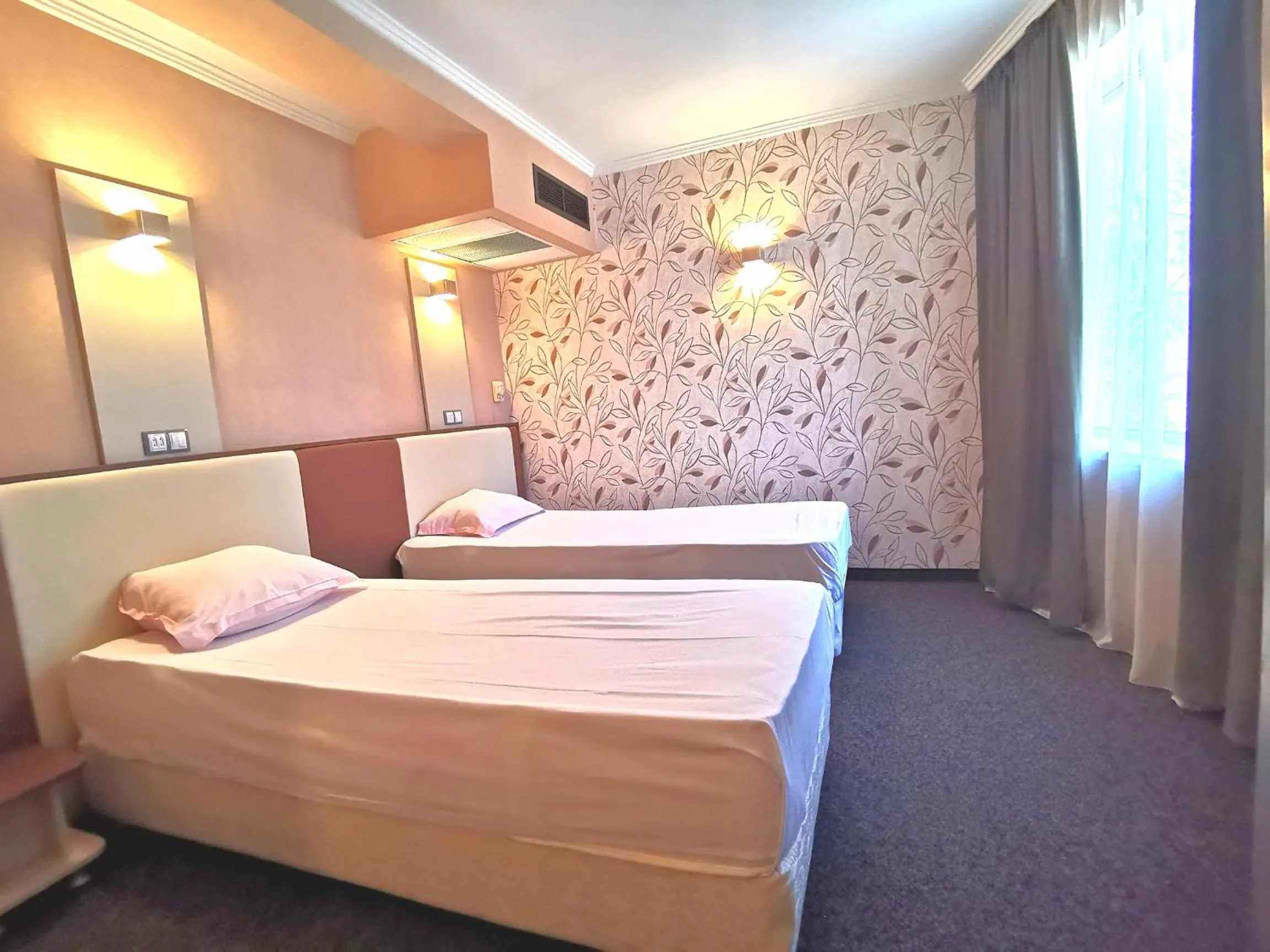 Bed in Elate Plaza Hotel