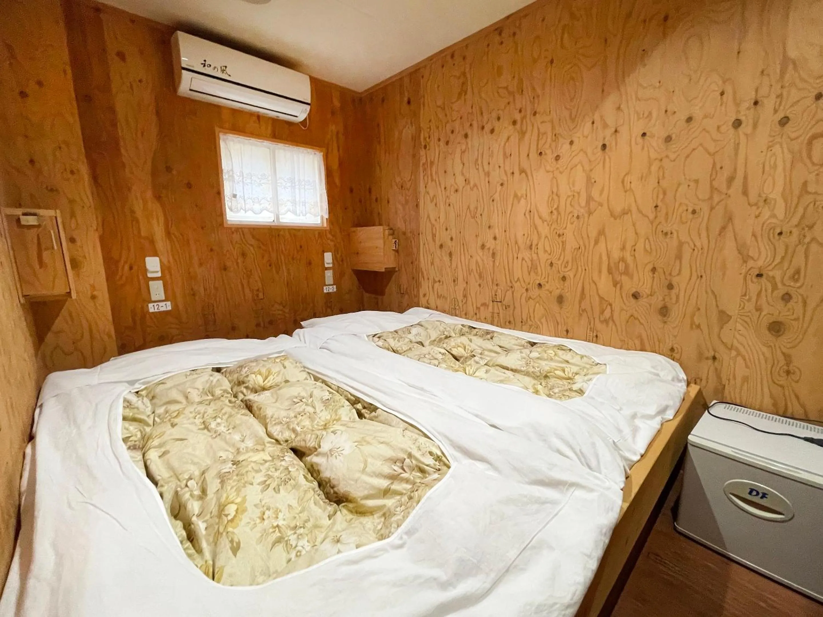 Bedroom, Bed in Guesthouse Otaru Wanokaze