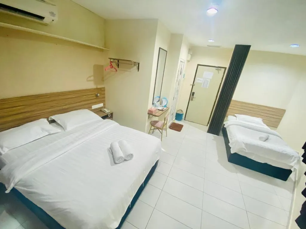 Bed in BG Business Hotel