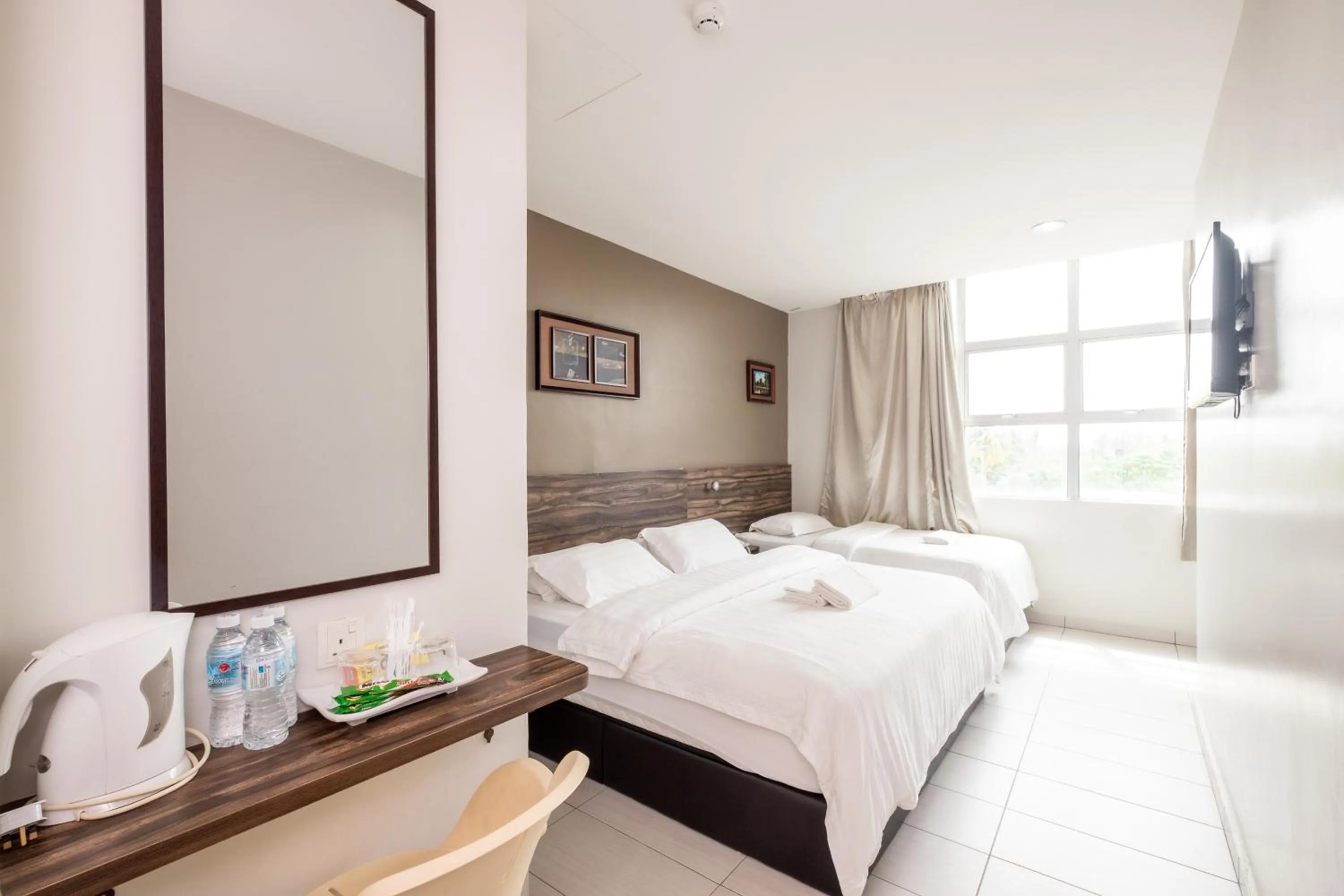 Bed in BG Business Hotel