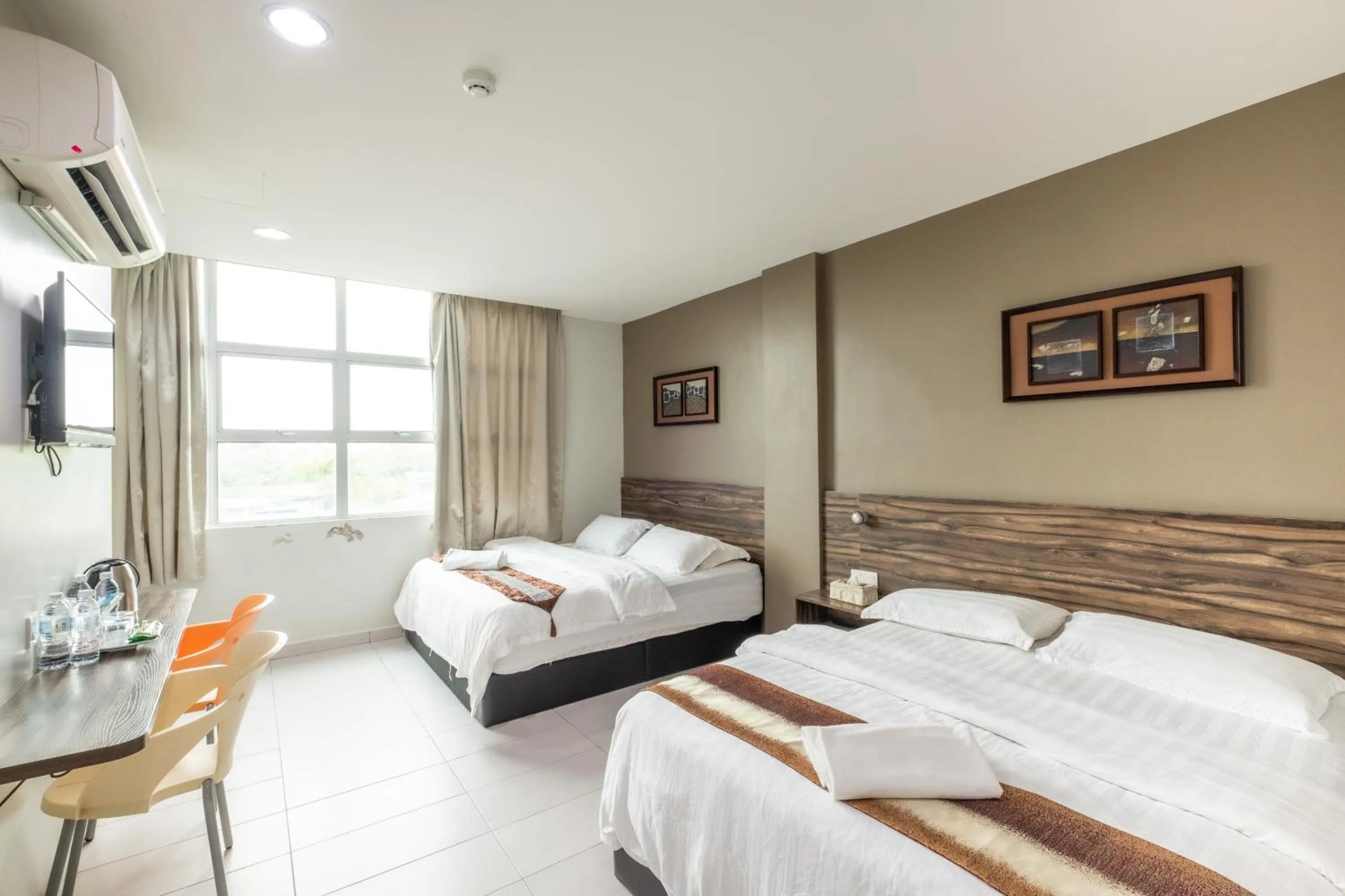 Bed in BG Business Hotel