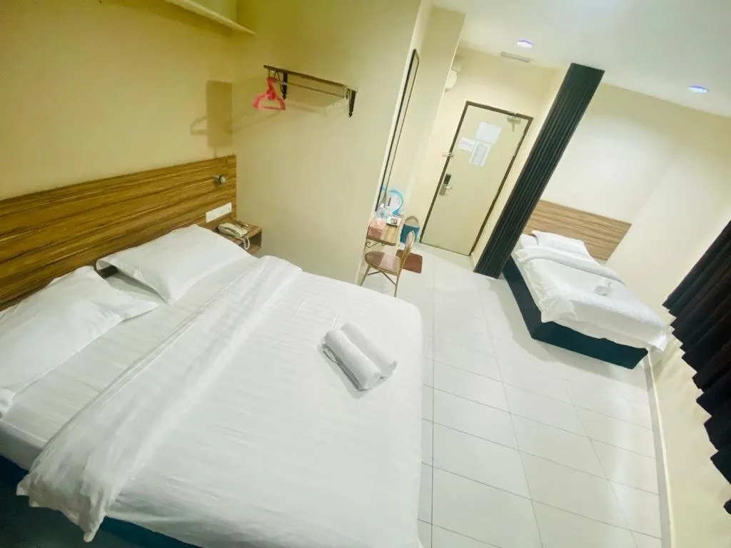 Bed in BG Business Hotel