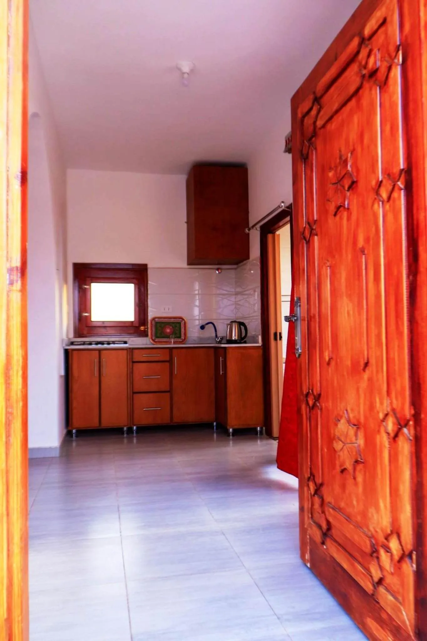 Kitchen or kitchenette in Thebes Hotel