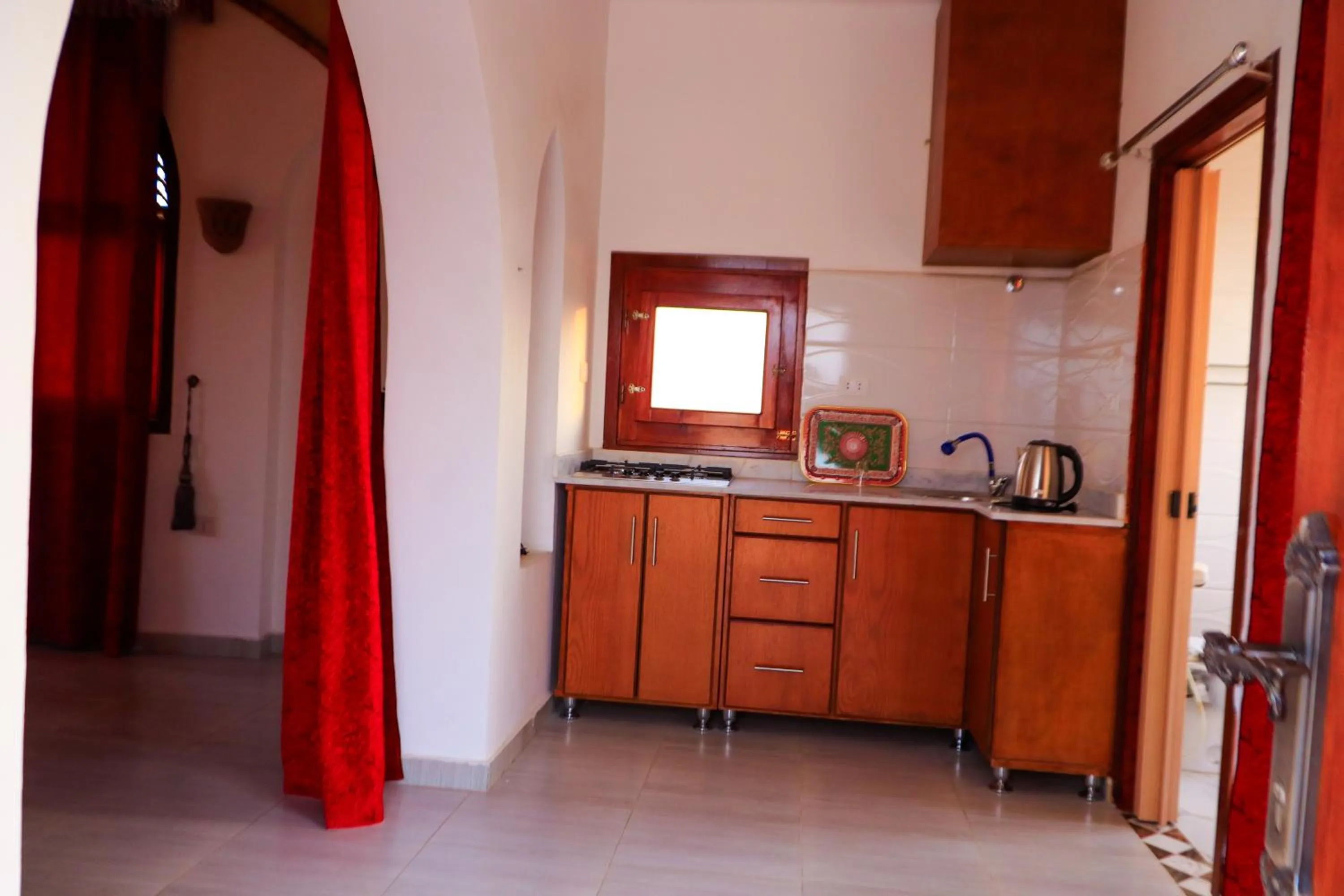 Kitchen or kitchenette in Thebes Hotel