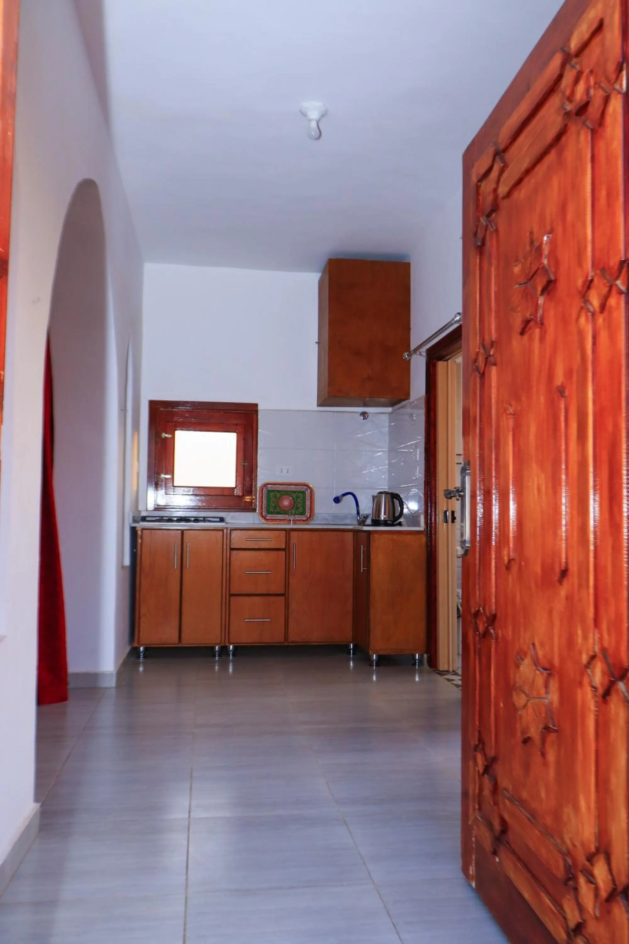 Kitchen or kitchenette in Thebes Hotel