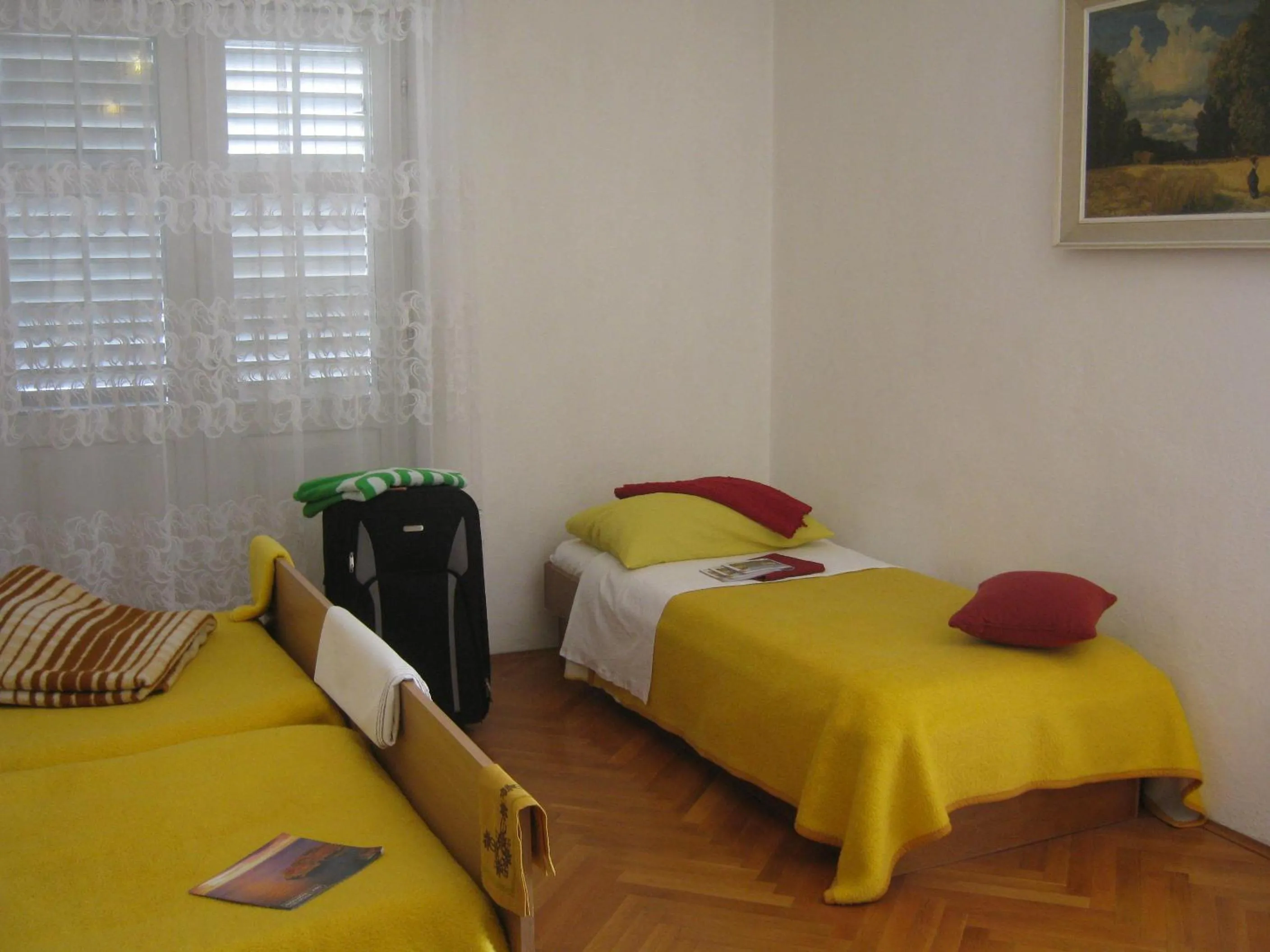 Bed in Apartments and Rooms Artemida