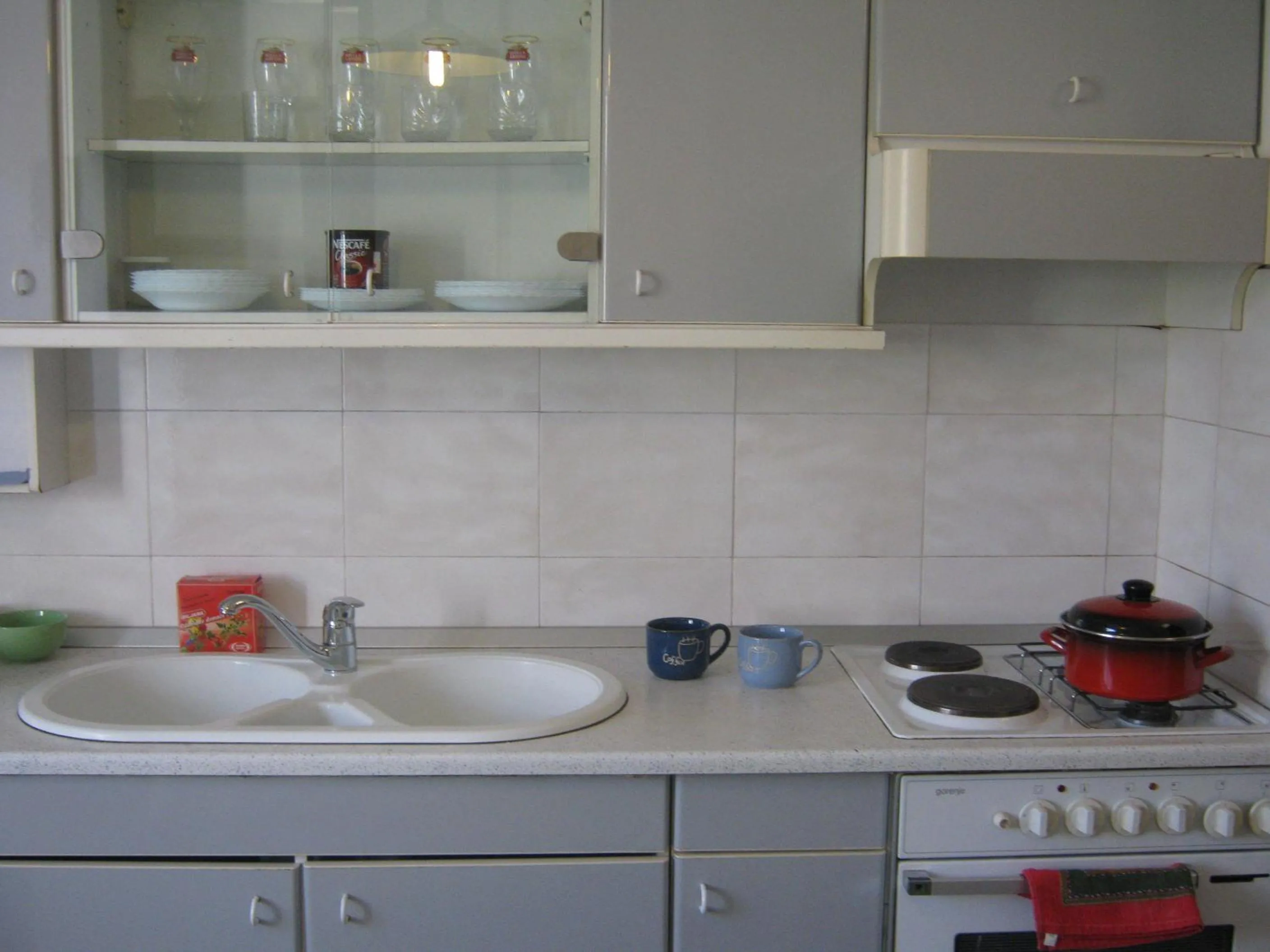 Kitchen or kitchenette in Apartments and Rooms Artemida