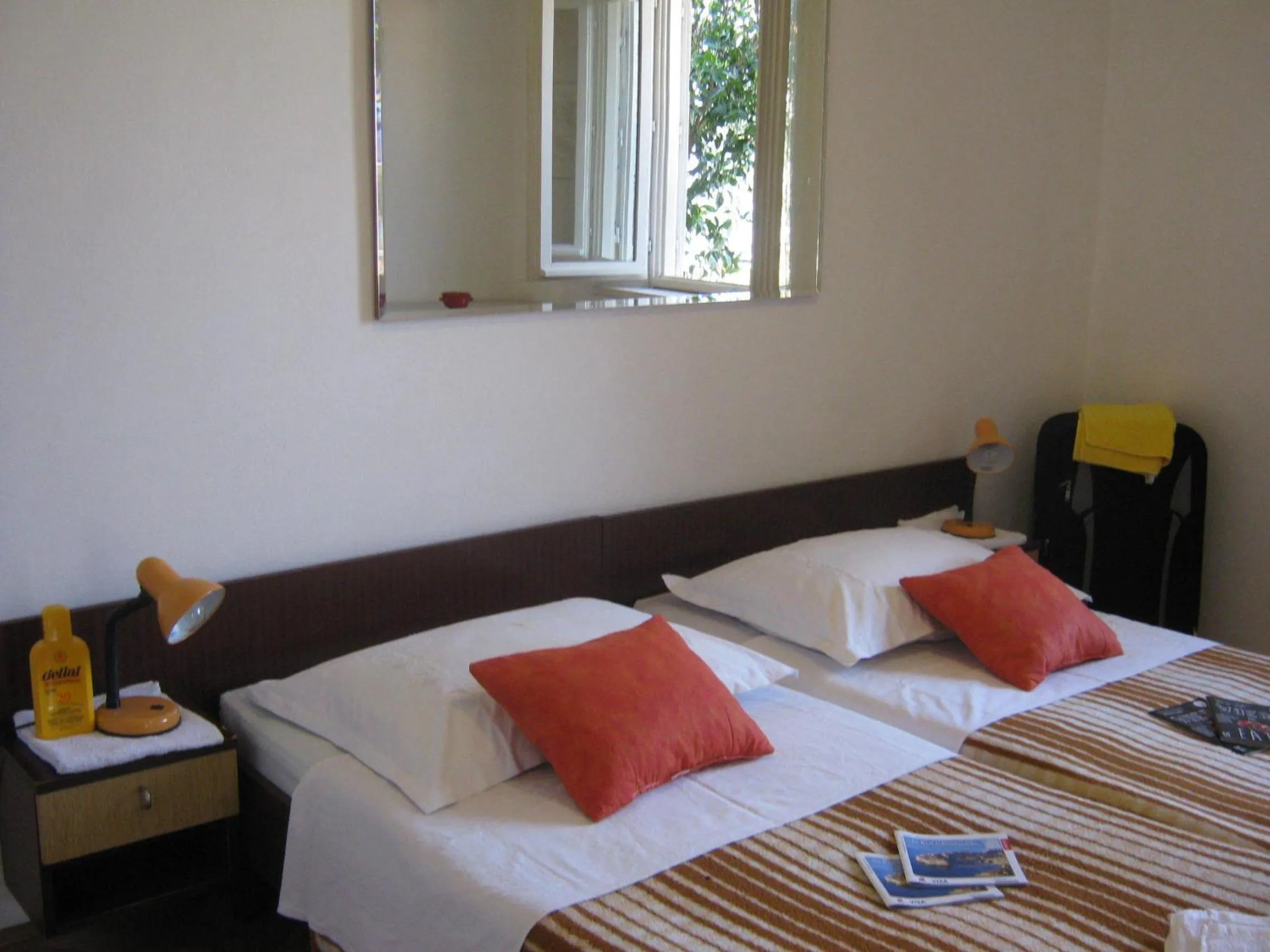 Bed in Apartments and Rooms Artemida