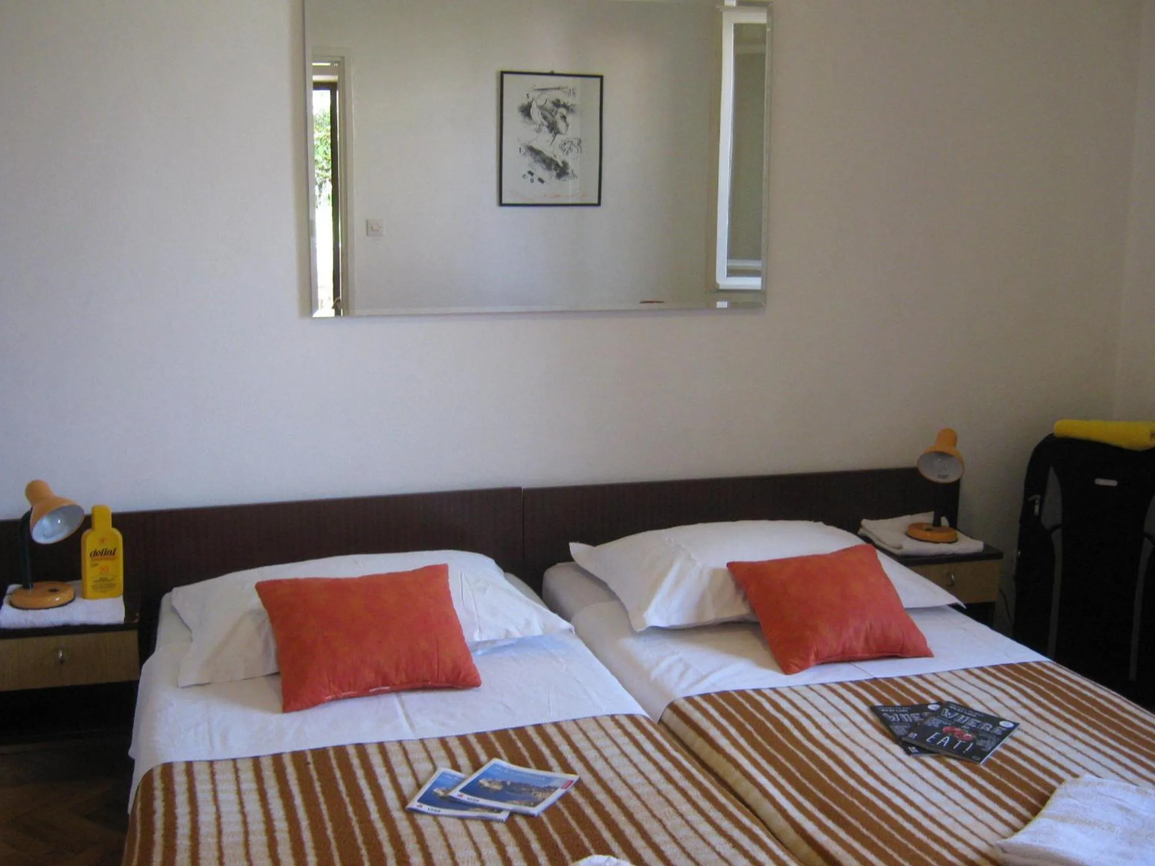 Bed in Apartments and Rooms Artemida