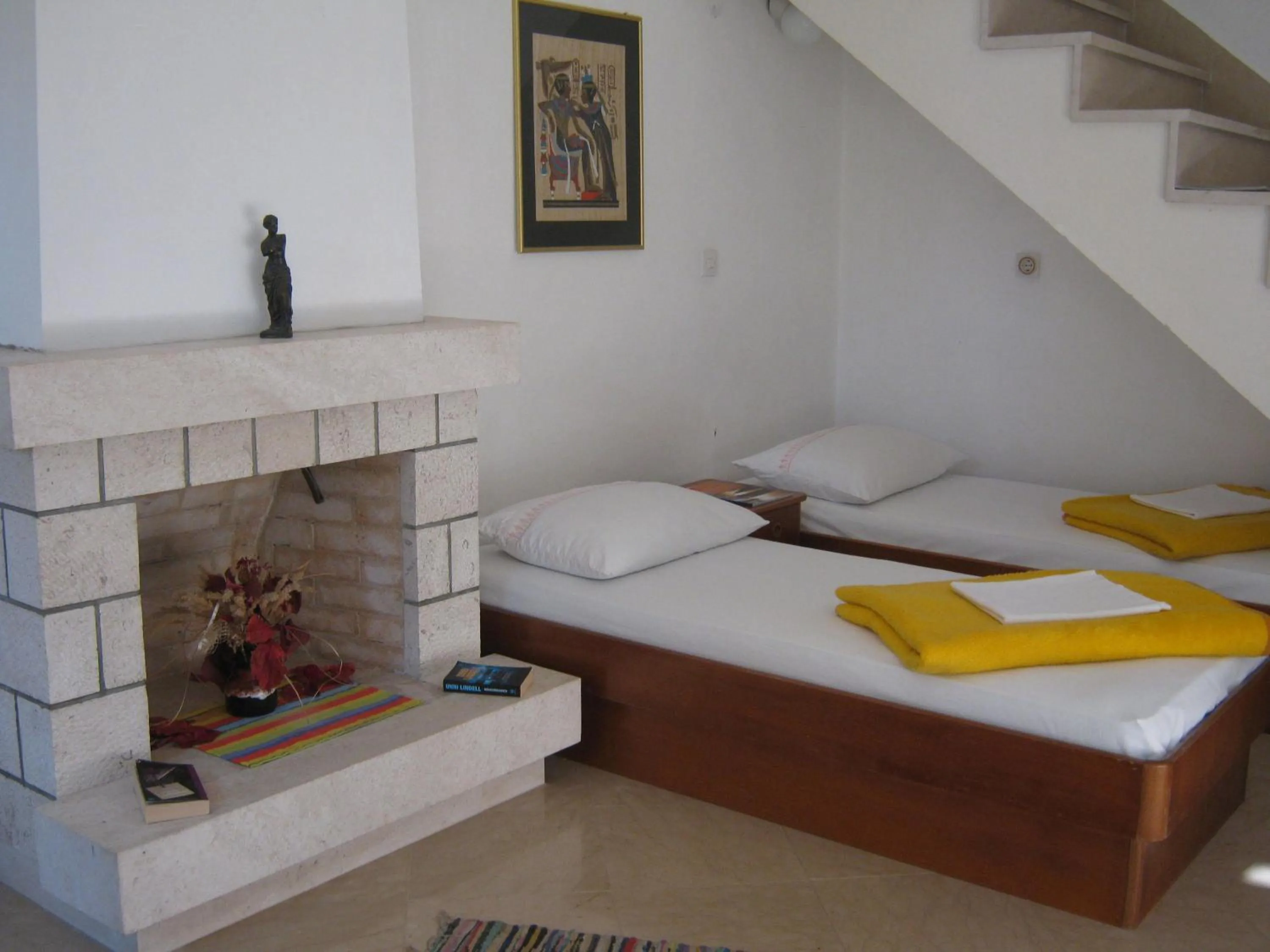 Bed in Apartments and Rooms Artemida