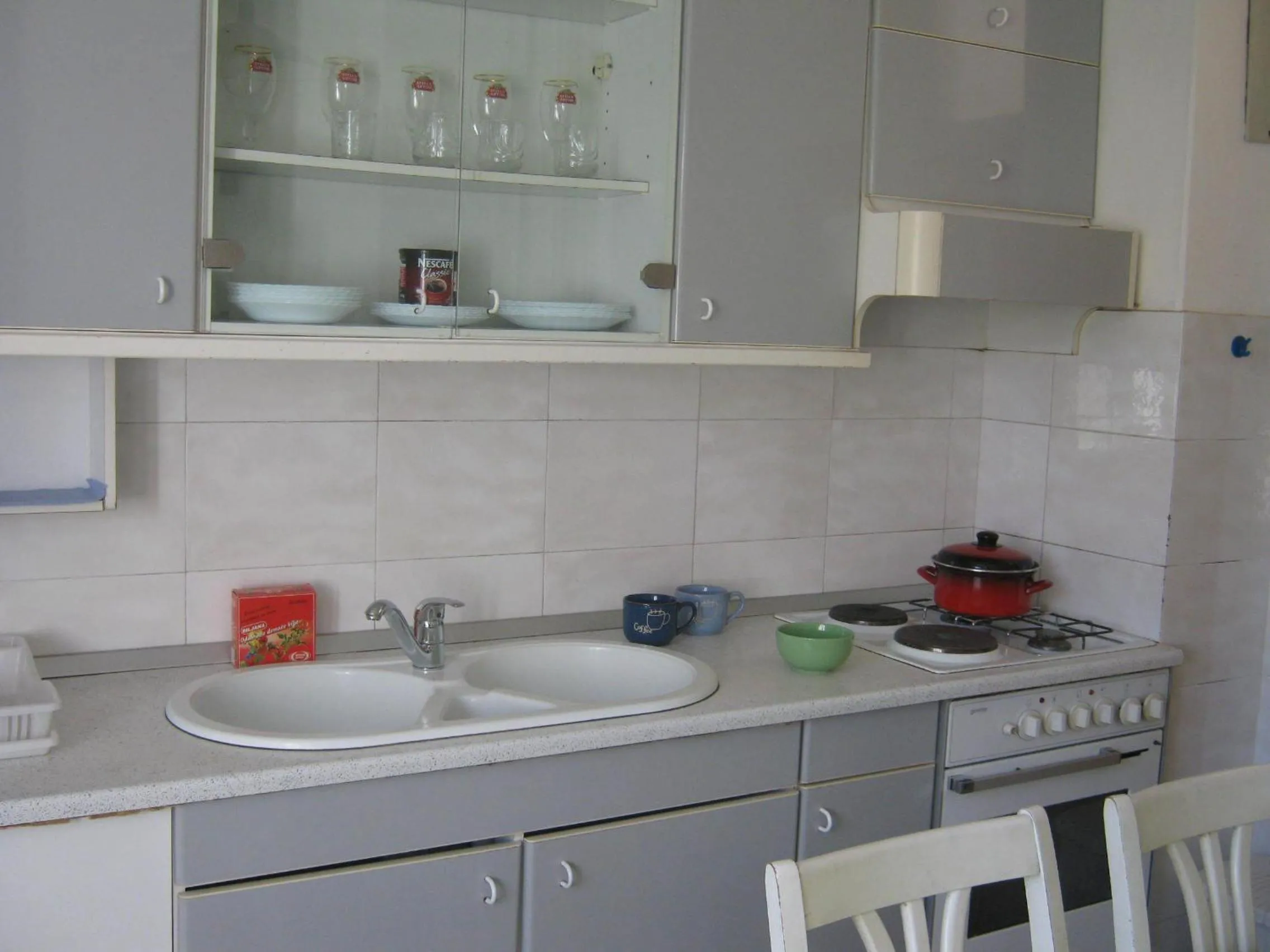 Kitchen or kitchenette in Apartments and Rooms Artemida
