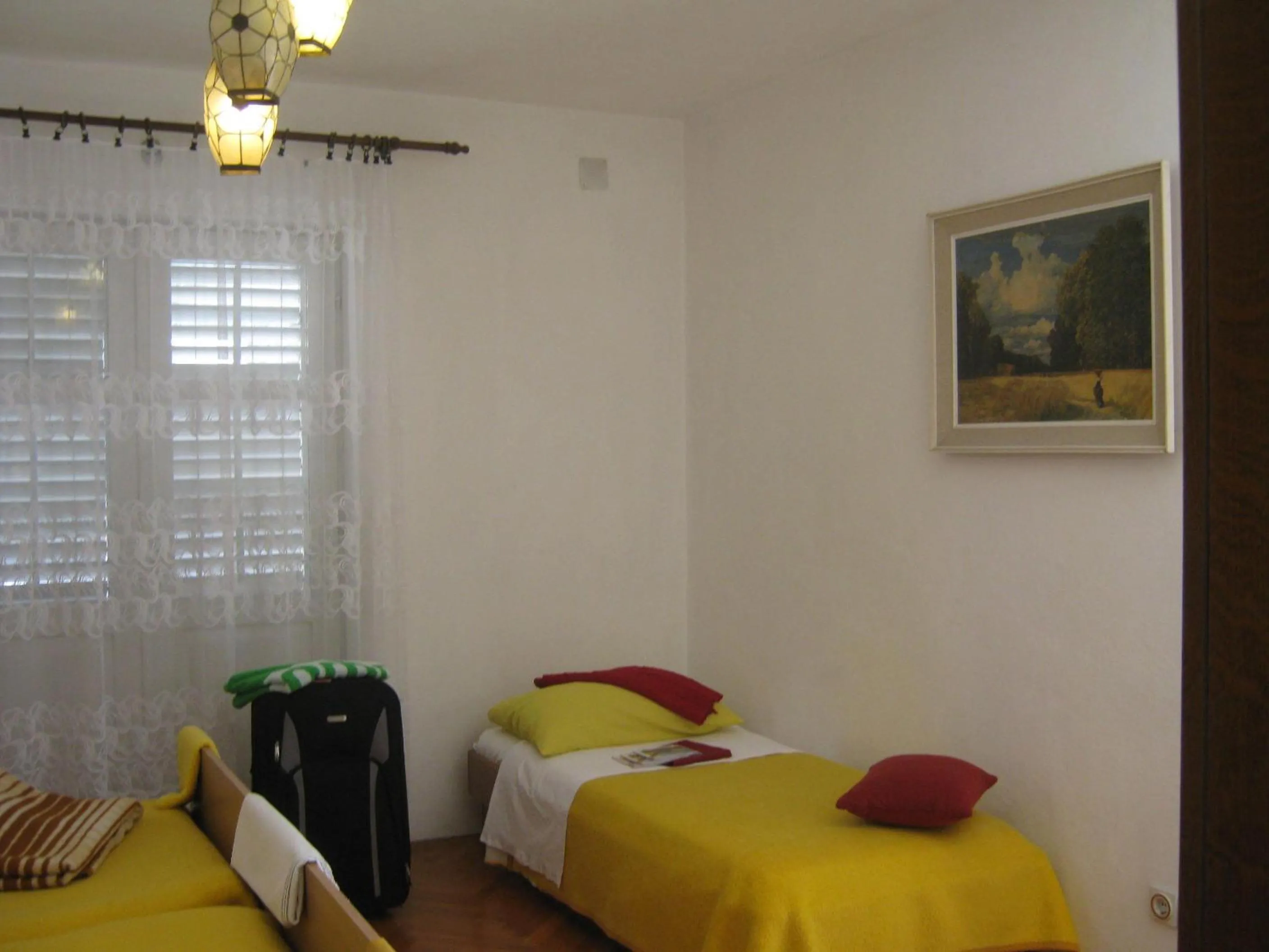 Bed in Apartments and Rooms Artemida