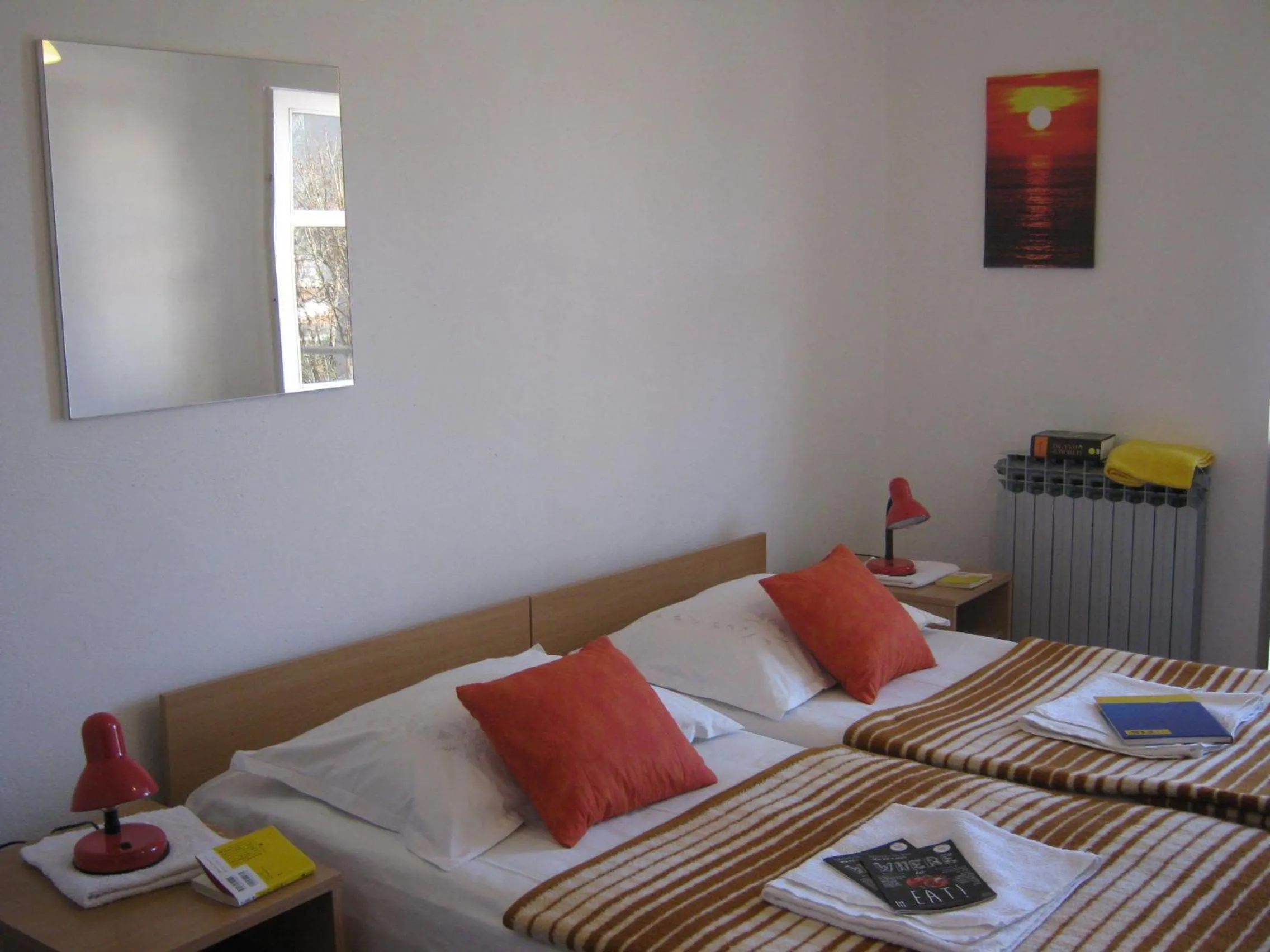 Bed in Apartments and Rooms Artemida