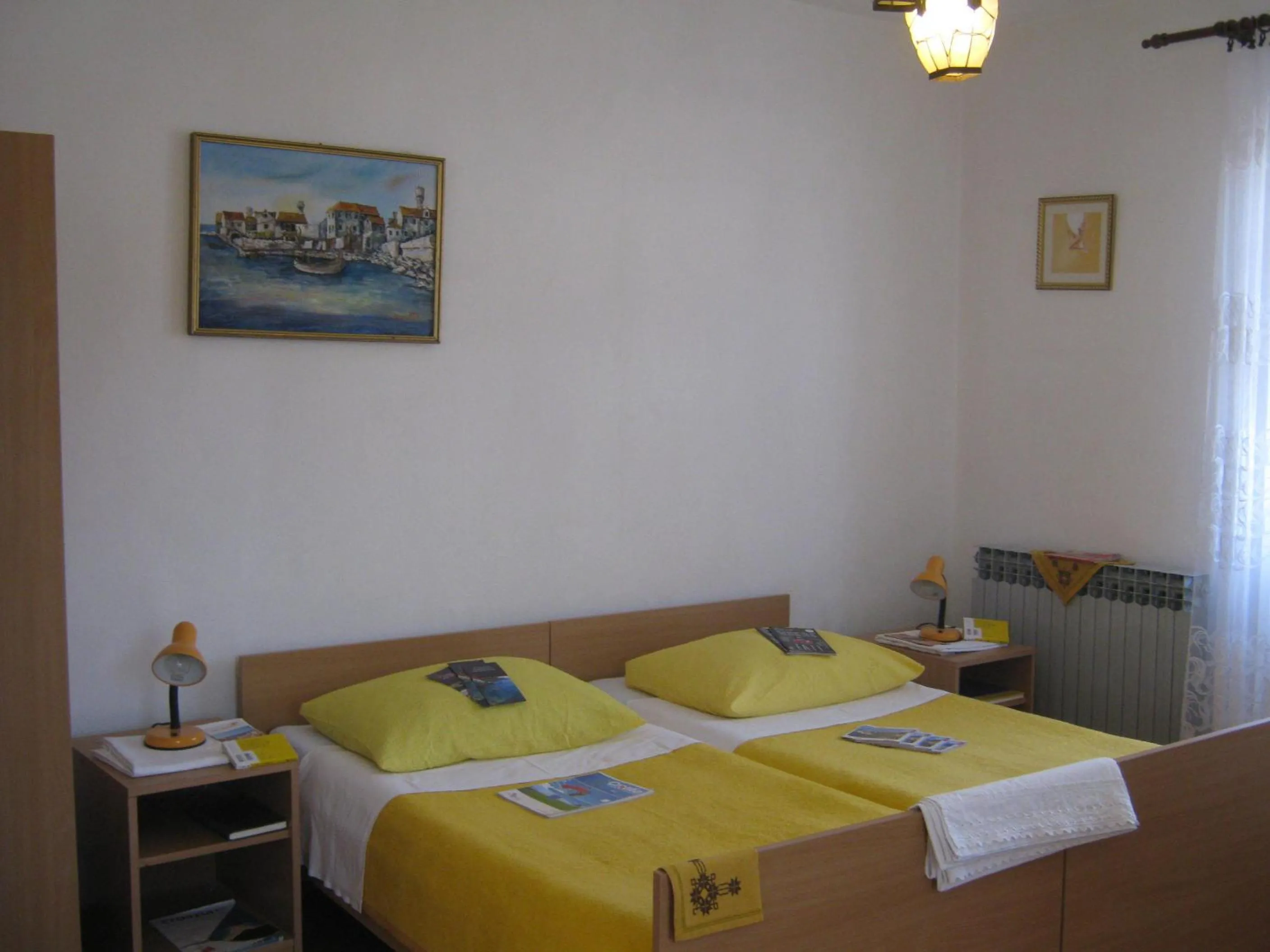 Bed in Apartments and Rooms Artemida