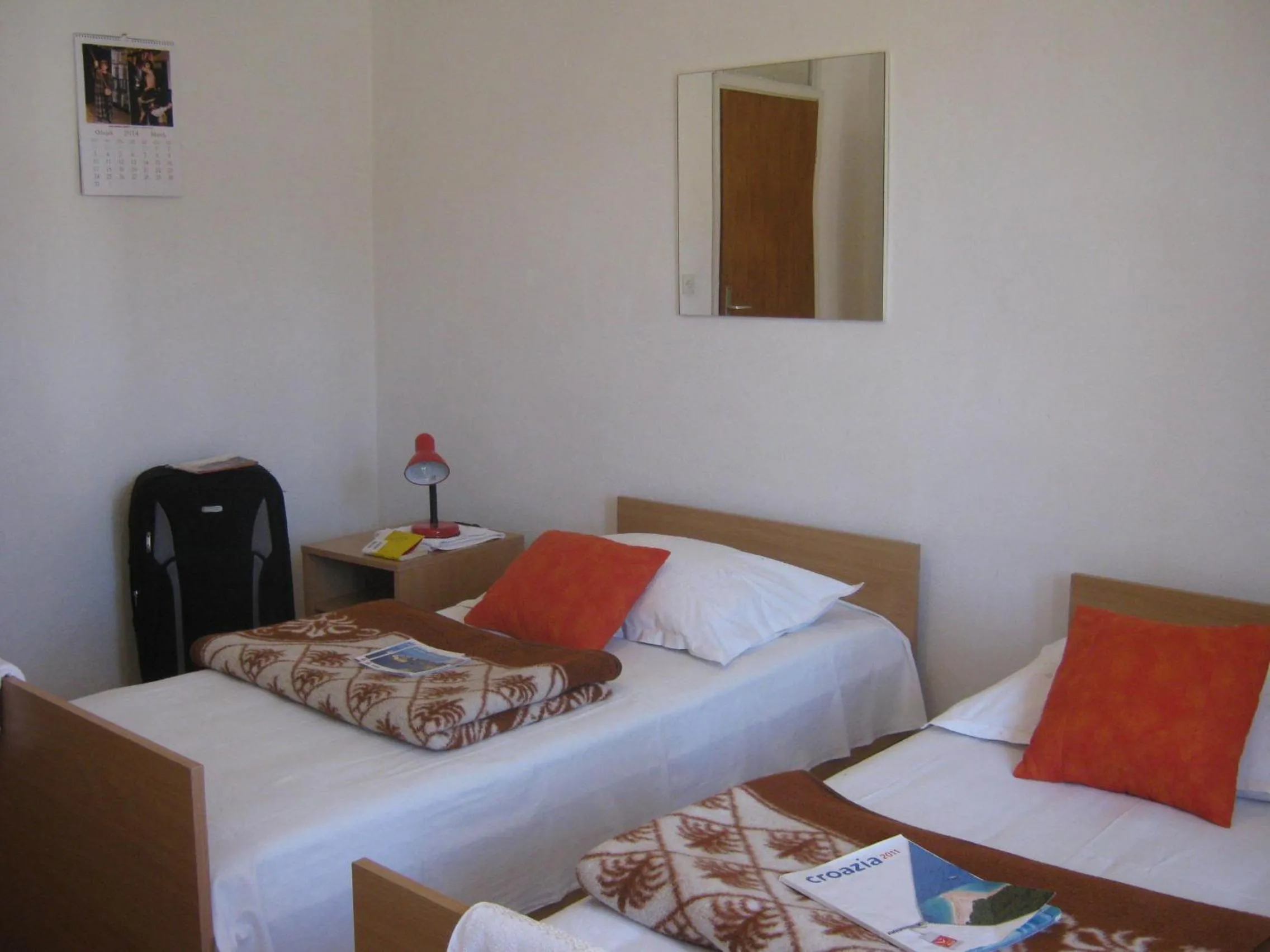 Bed in Apartments and Rooms Artemida