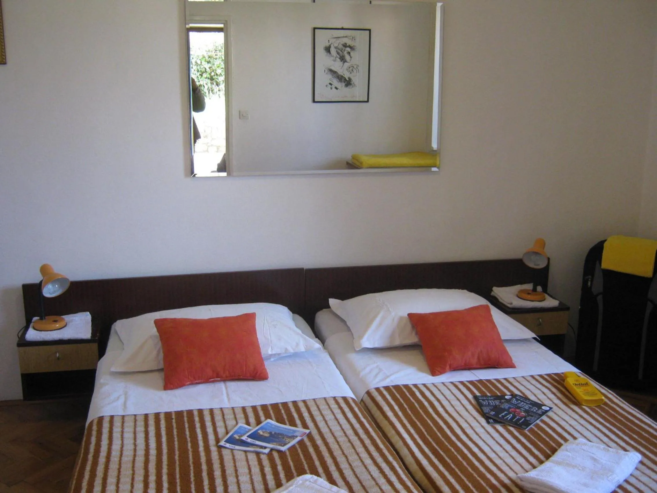 Bed in Apartments and Rooms Artemida