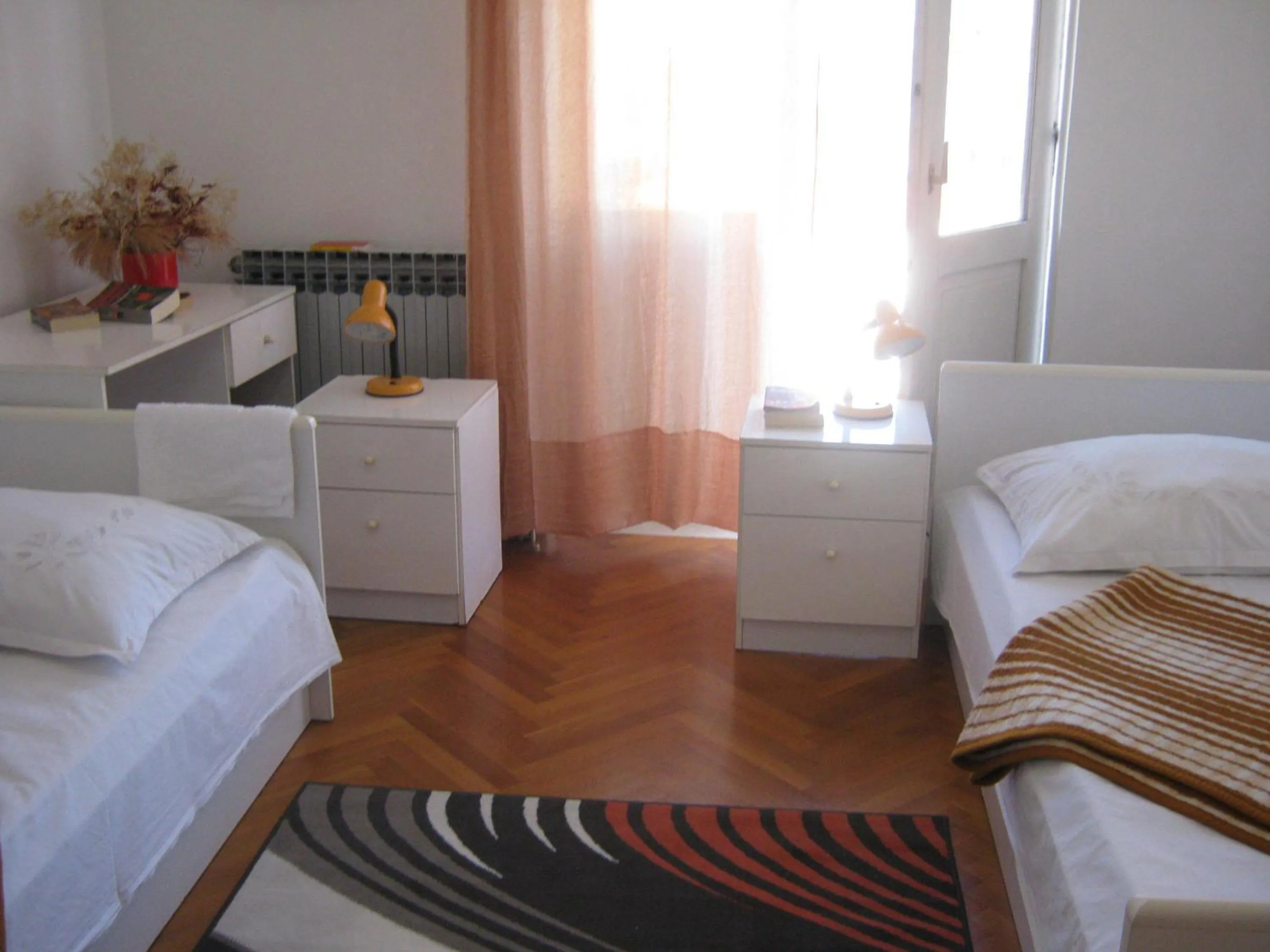 Bed in Apartments and Rooms Artemida