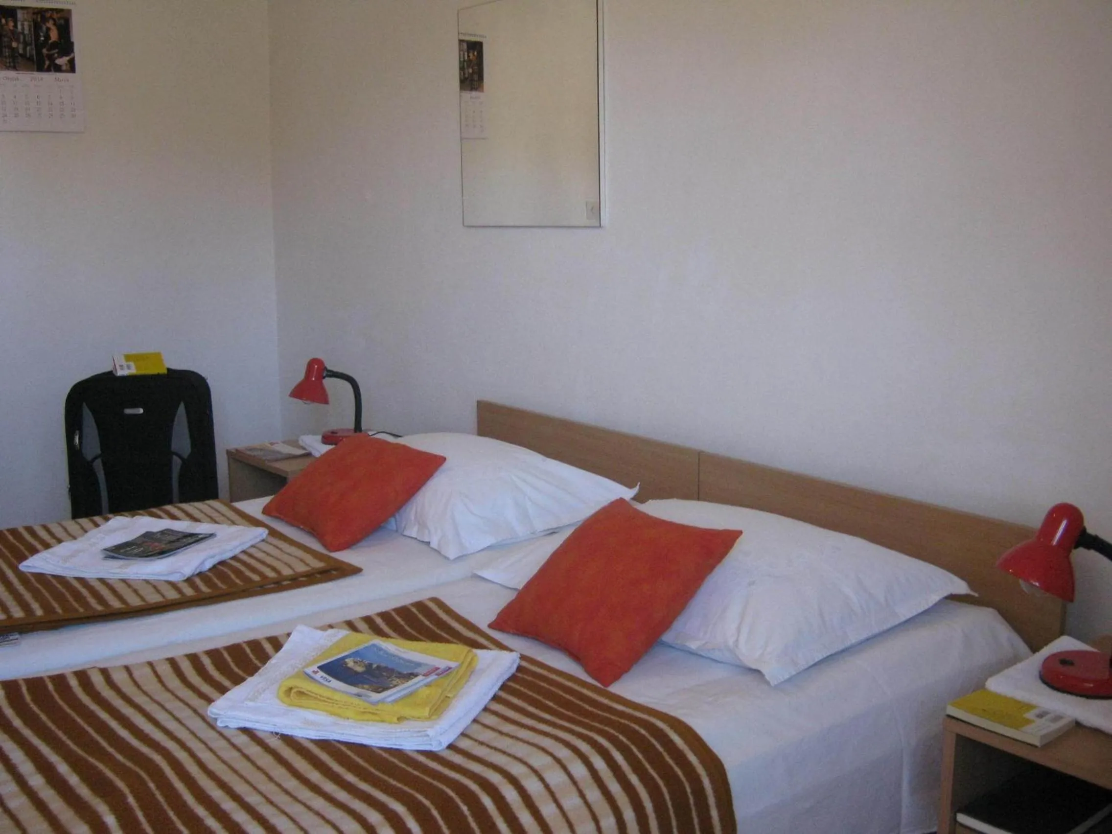 Bed in Apartments and Rooms Artemida