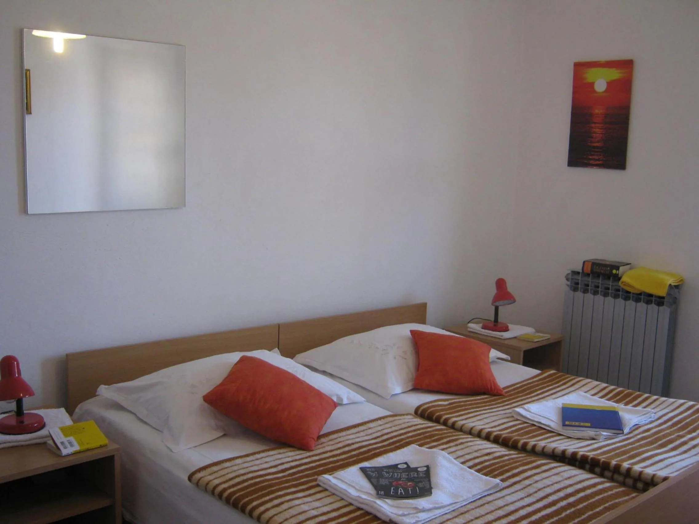 Bed in Apartments and Rooms Artemida