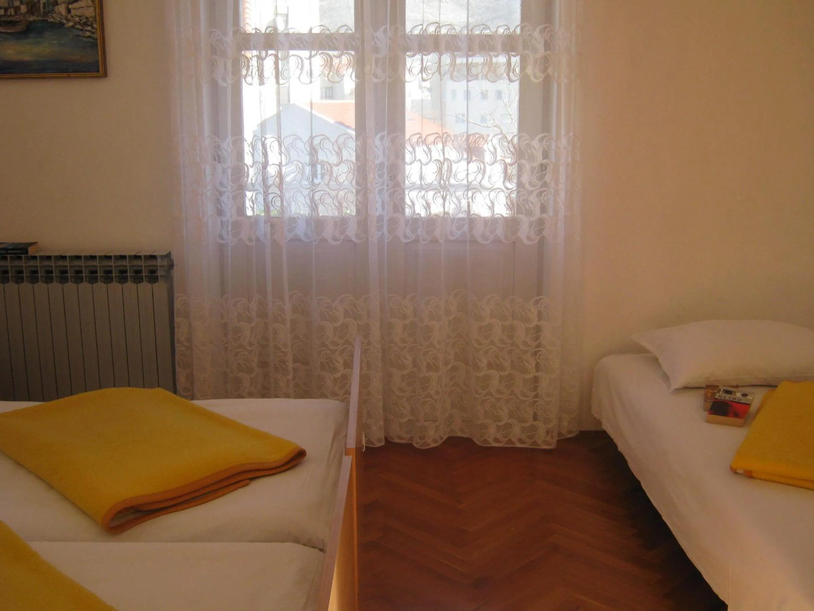Bed in Apartments and Rooms Artemida