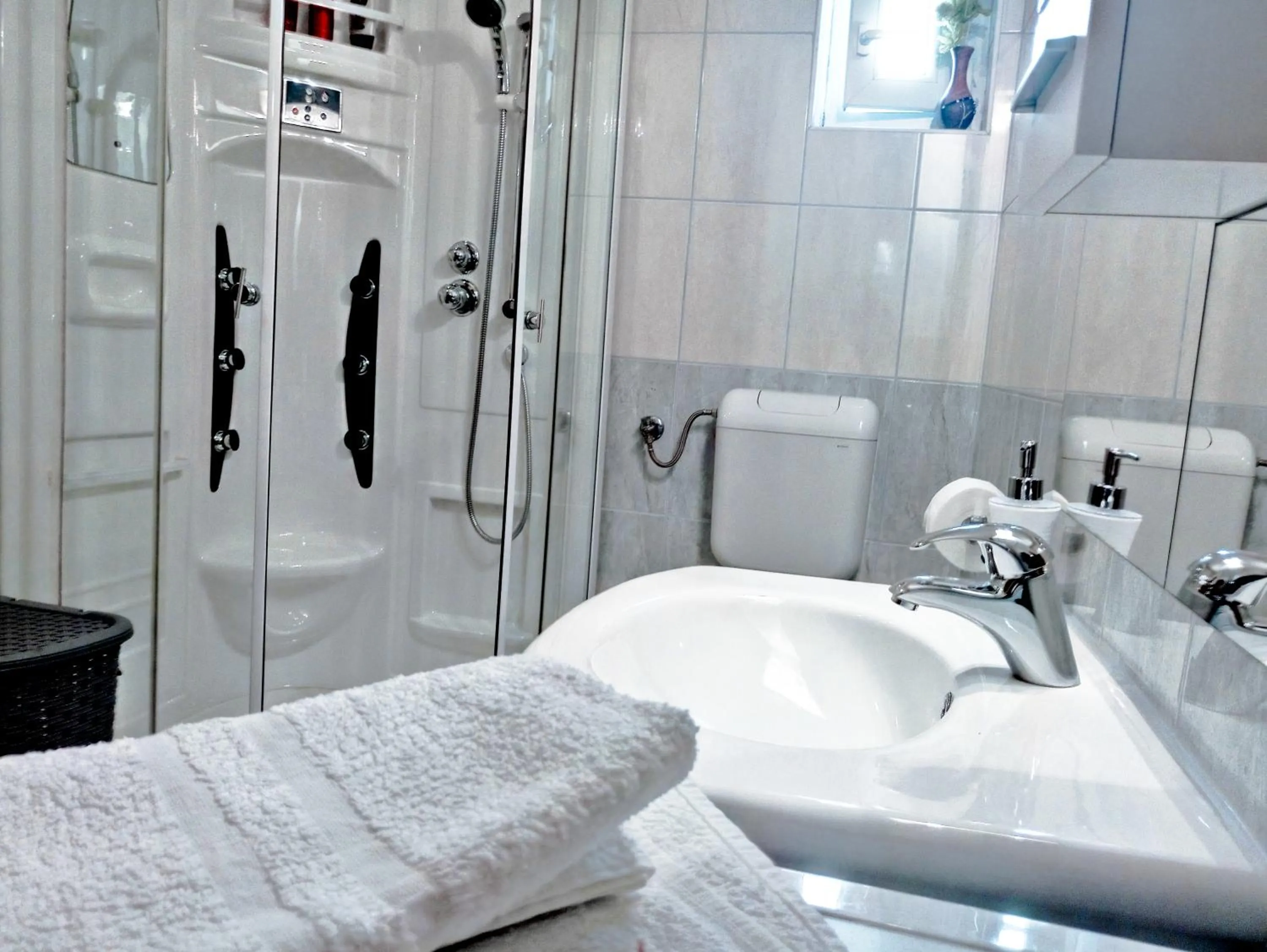 Shower in Adria Apartments and Rooms