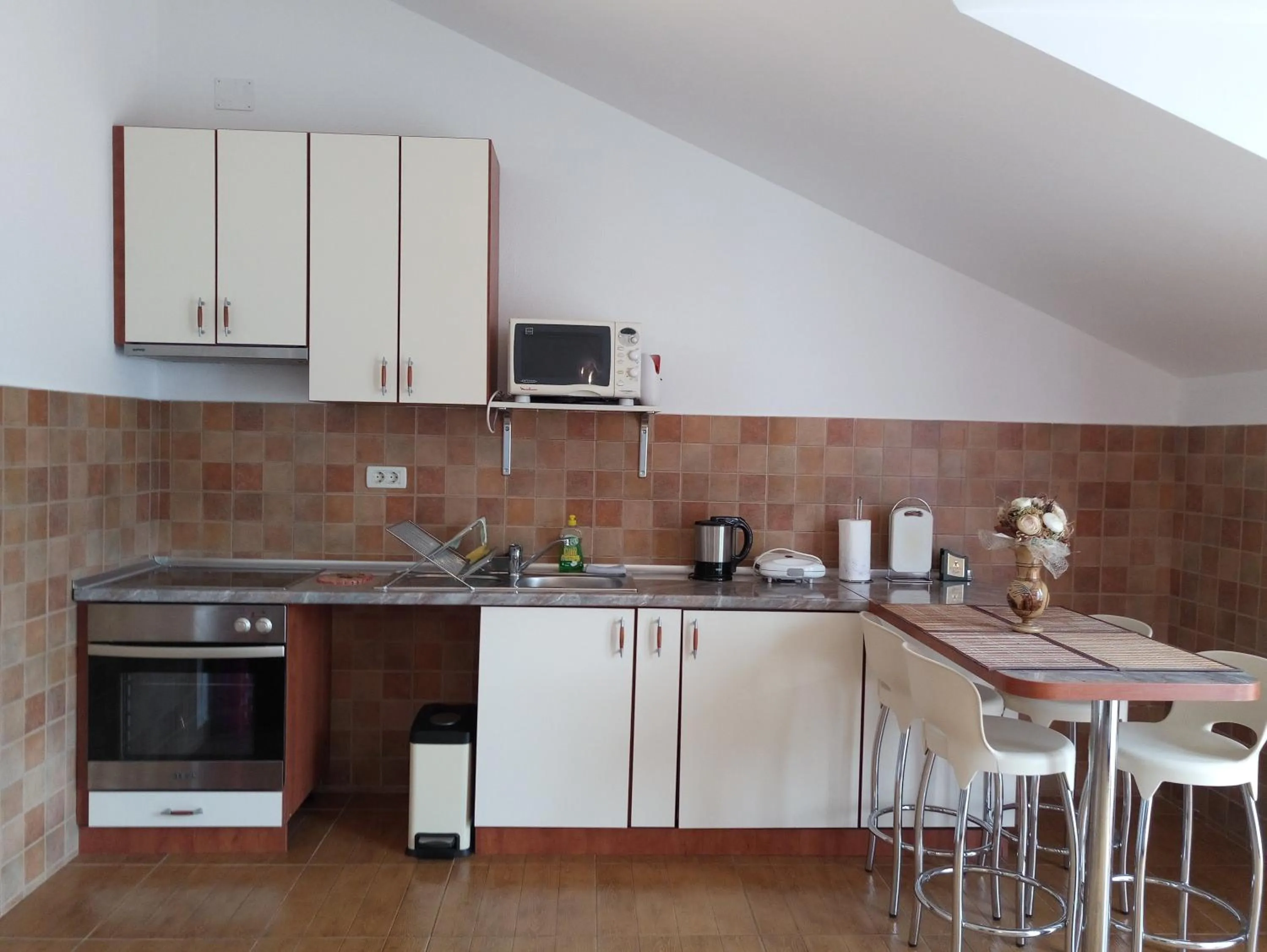 Kitchen or kitchenette in Adria Apartments and Rooms