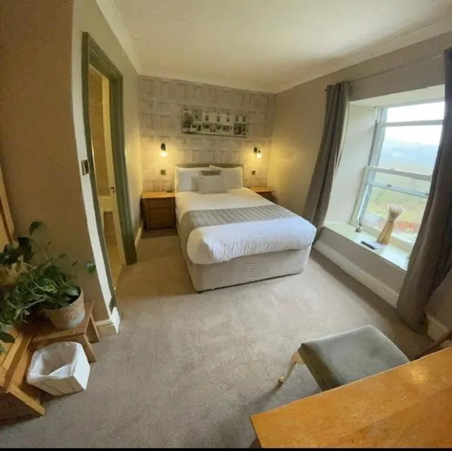 Bed in The Mortal Man Inn