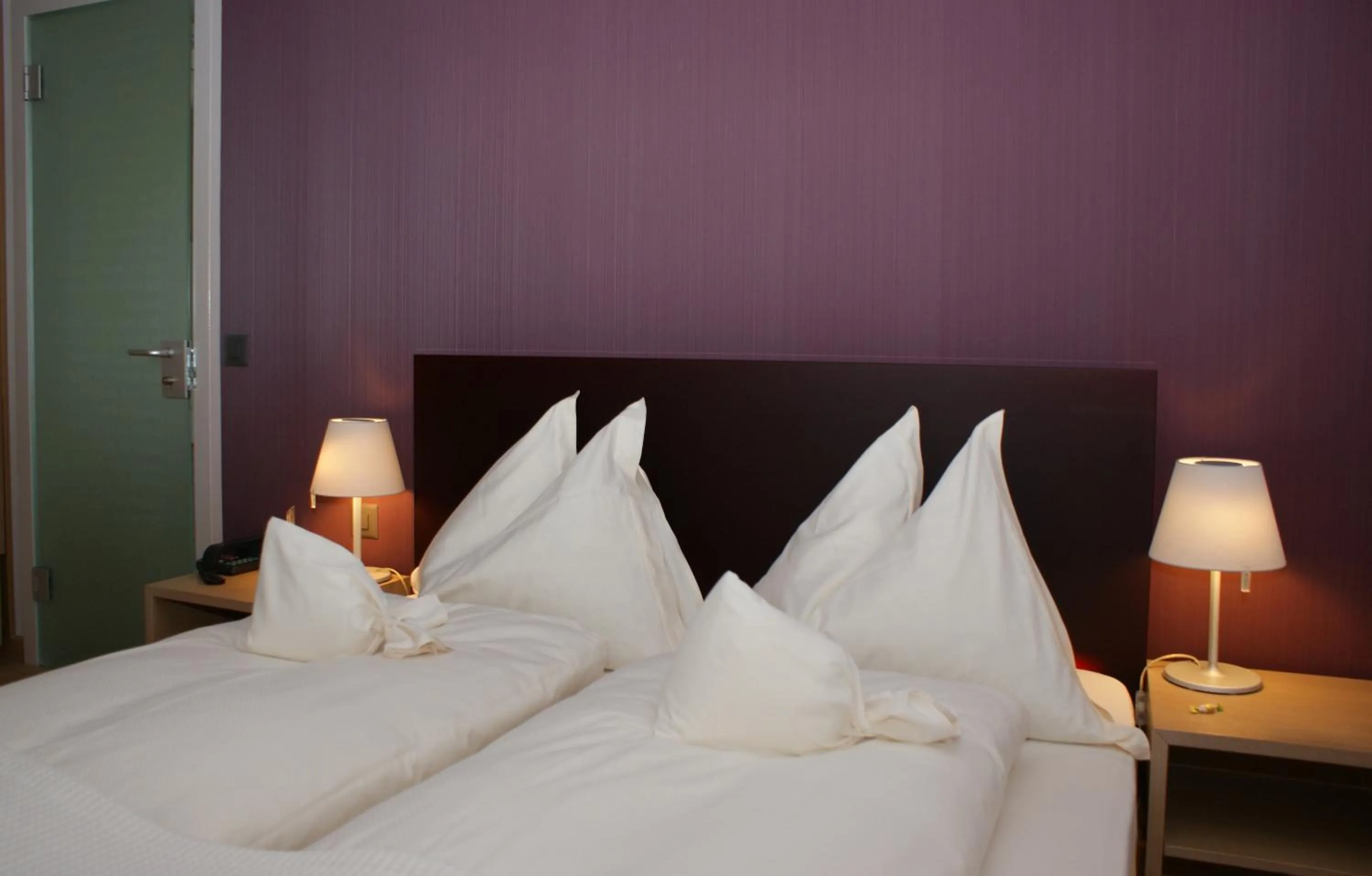 Bed in Hotel Jean-Jacques Rousseau