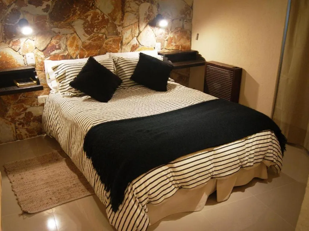 Bed in Posada Del Fin Del Mundo