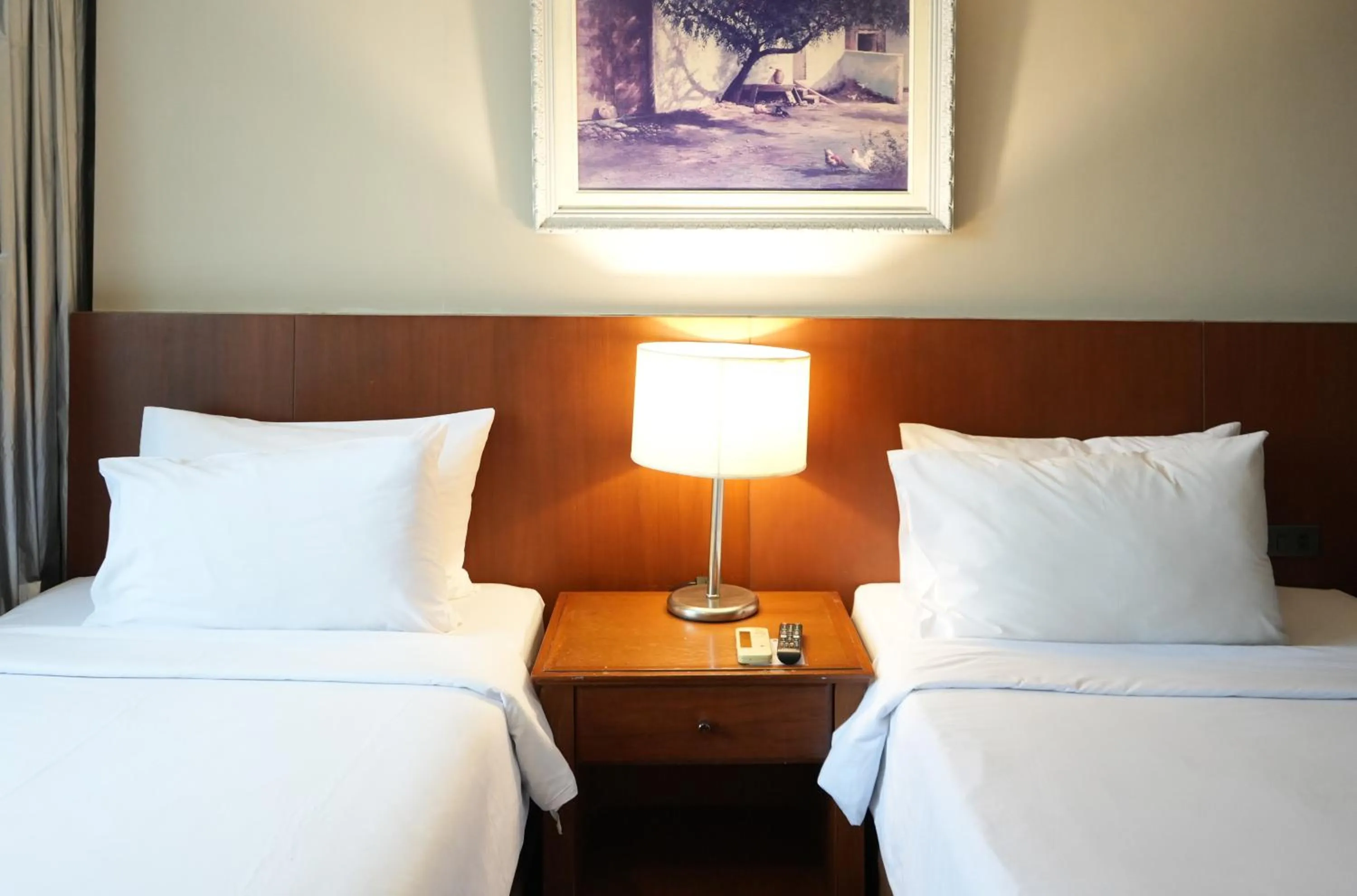 Bed in Royal Suite Hotel Bangkok