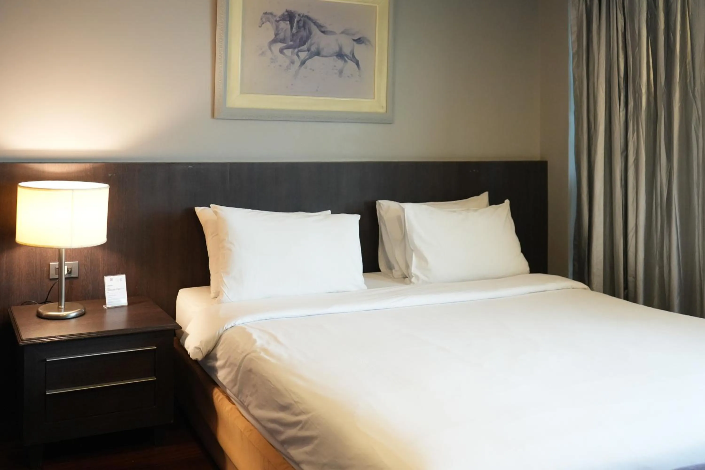 Bed in Royal Suite Hotel Bangkok