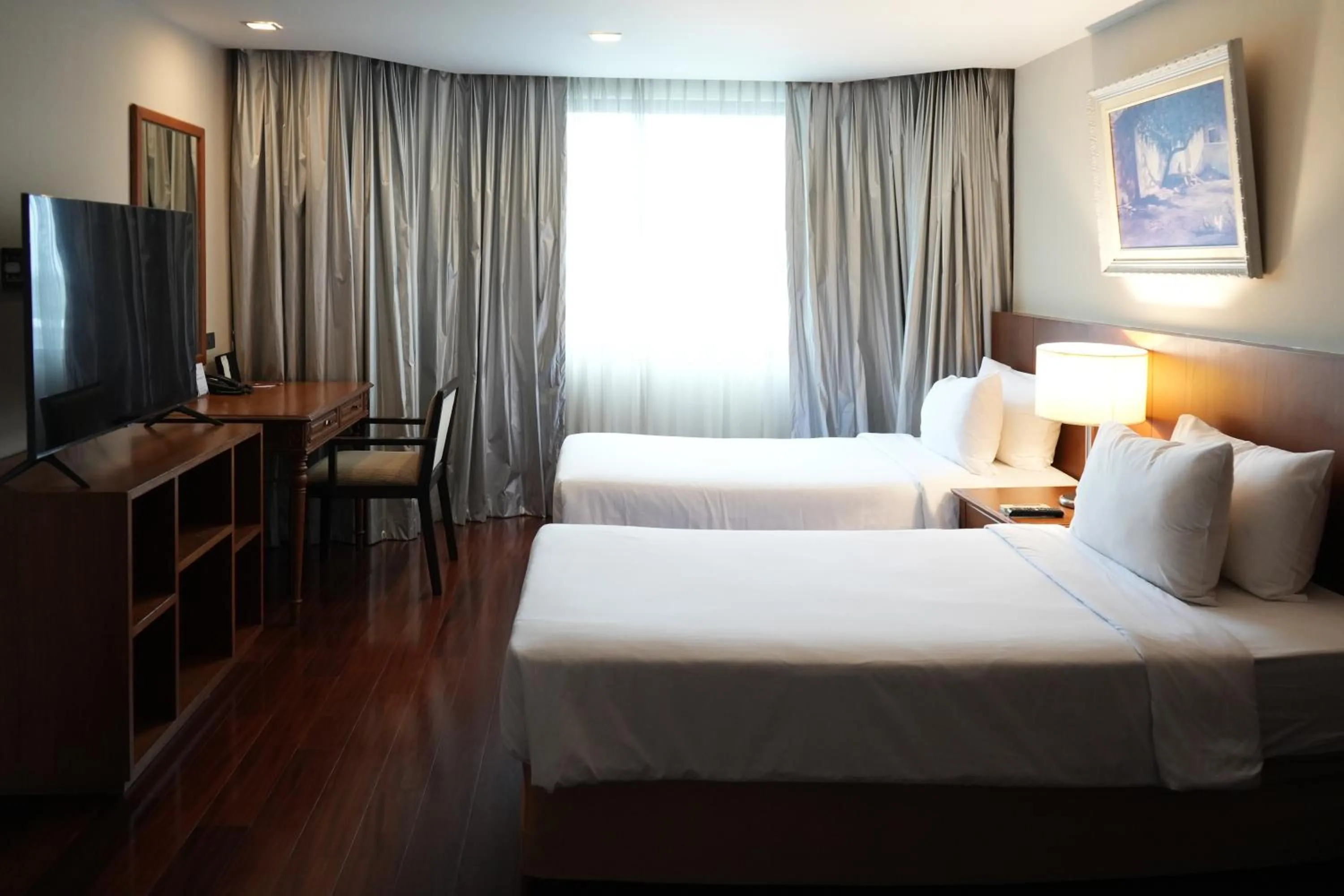 Bed in Royal Suite Hotel Bangkok