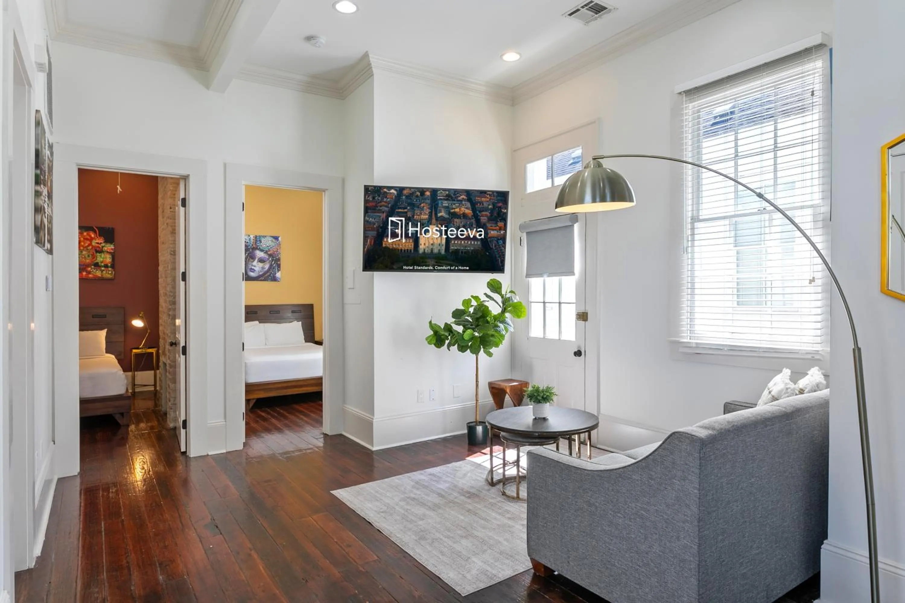 Living room, Bed in Charming 2BR on Carondelet by Hosteeva