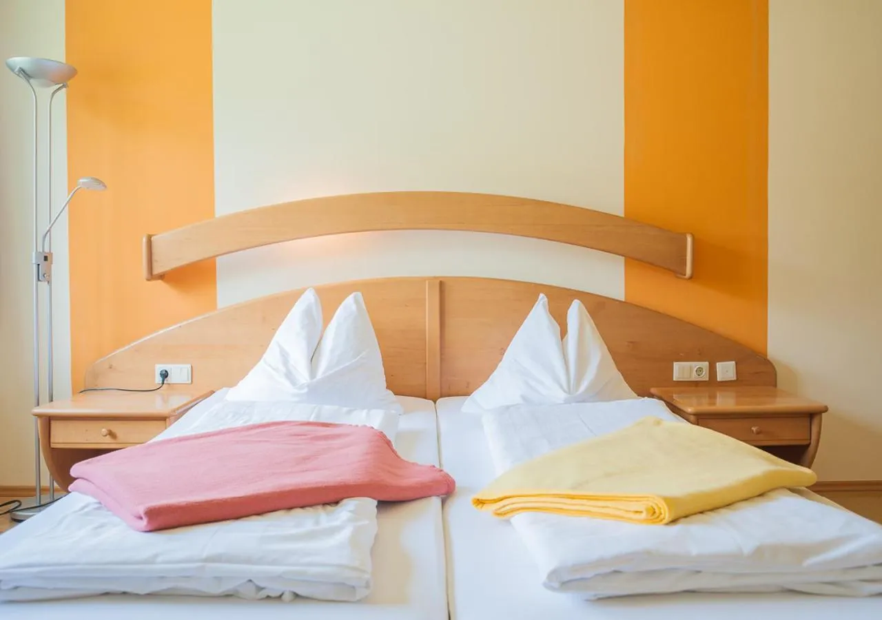 Bed in STIERSCHNEIDER'S Weinhotel Wachau & Wiazhaus