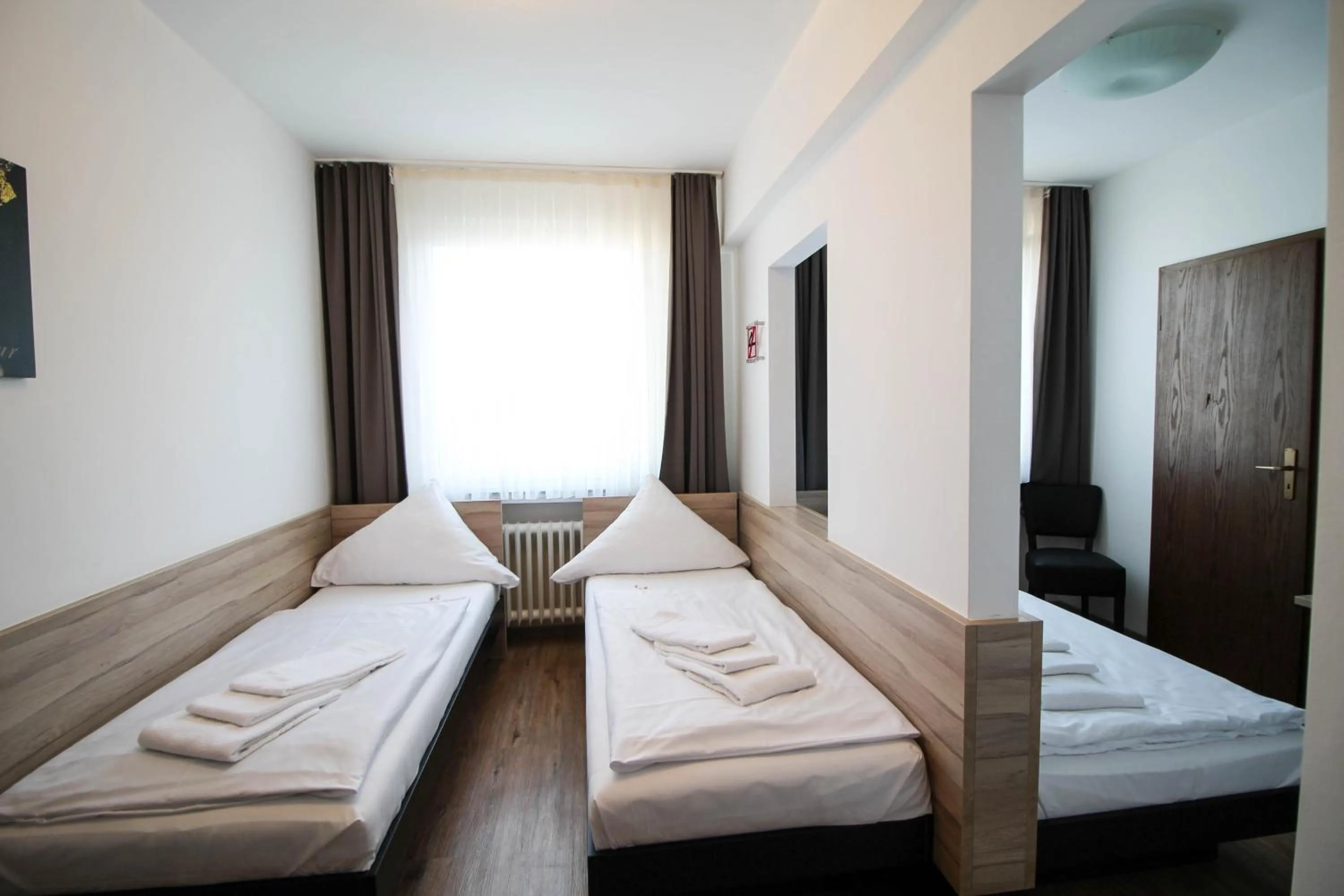 Photo of the whole room, Bed in Center Hotel Essen